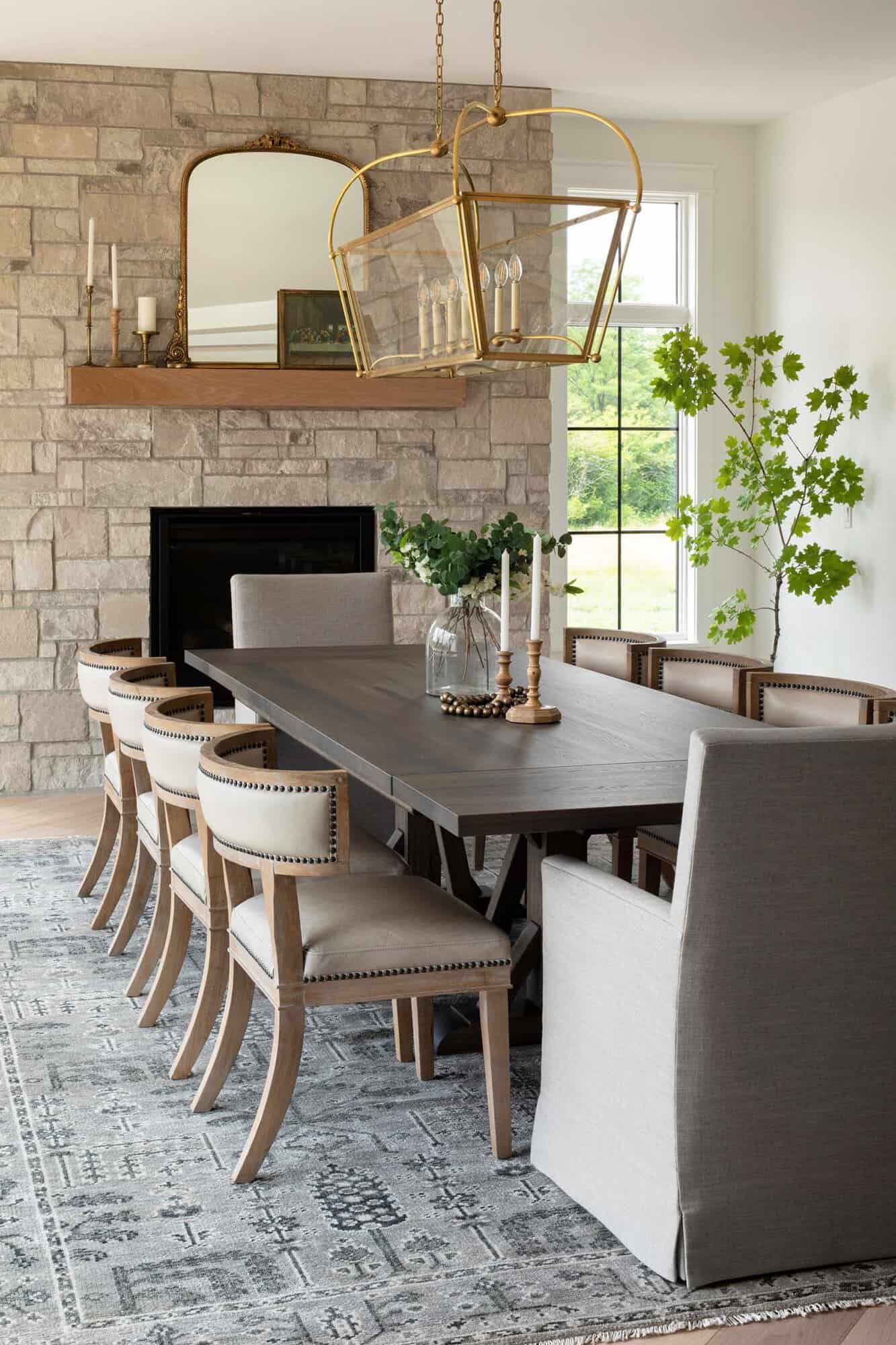 transitional style dining room with a fireplace