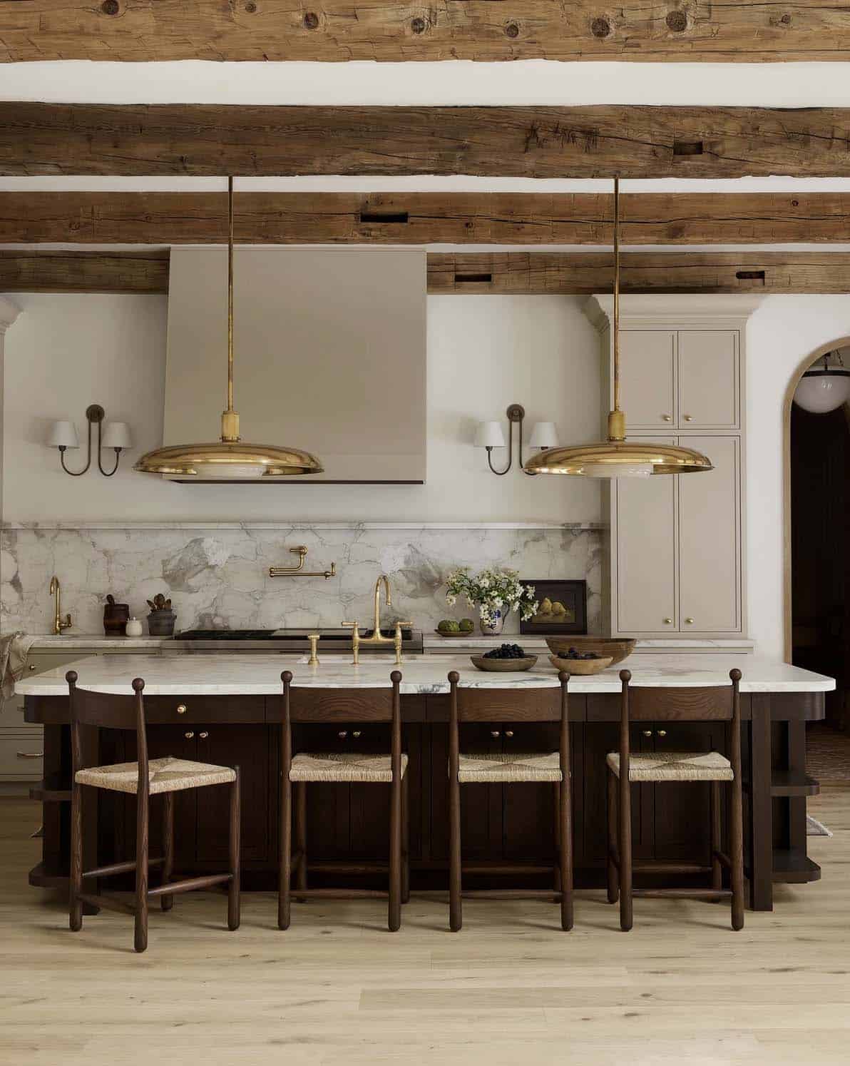 transitional style kitchen with a large island and pendant lights