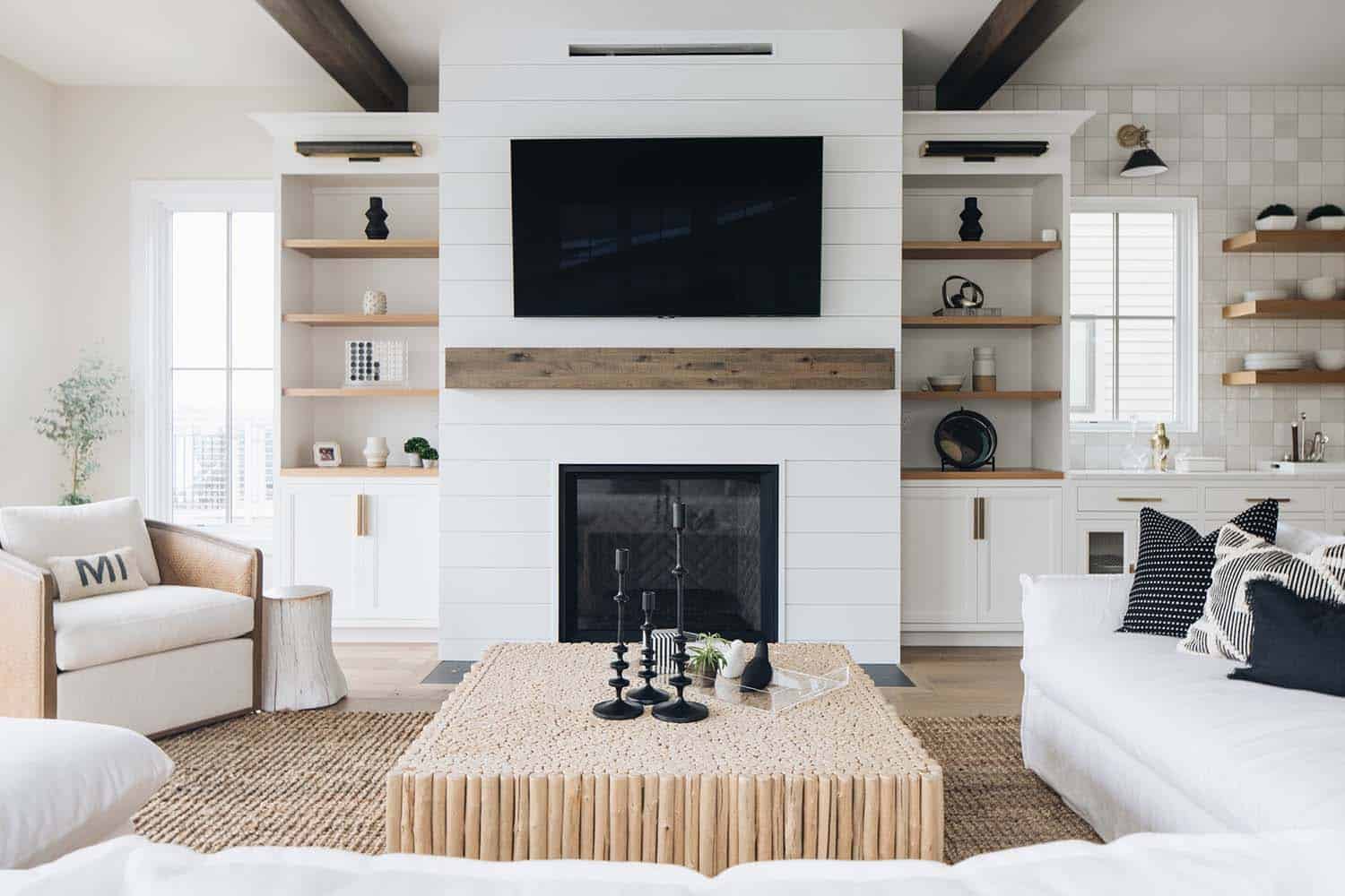 beach style living room with a fireplace
