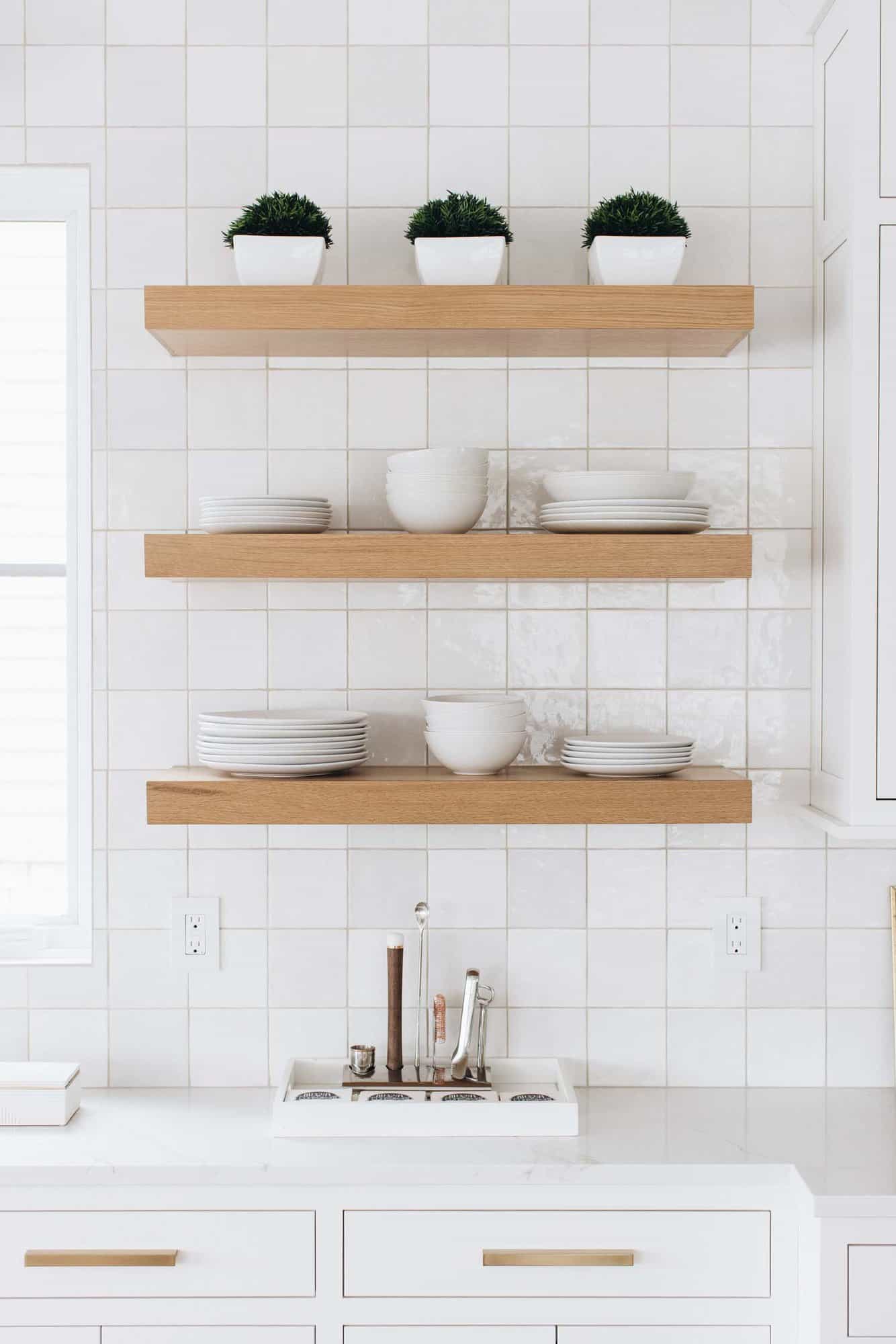 beach style kitchen with floating shelves