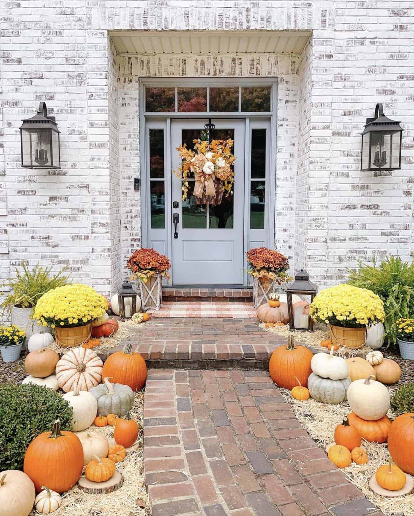 harvest front porch with lots of pumpkins and mums
