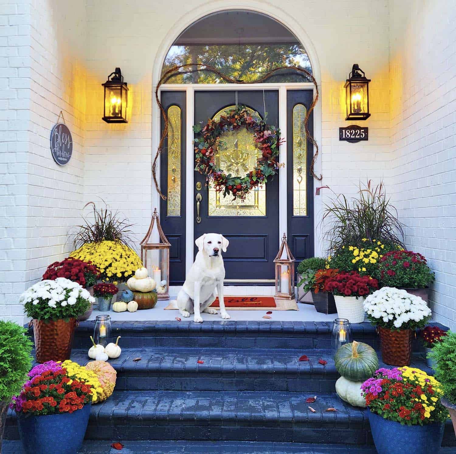 fall front porch with colorful mums