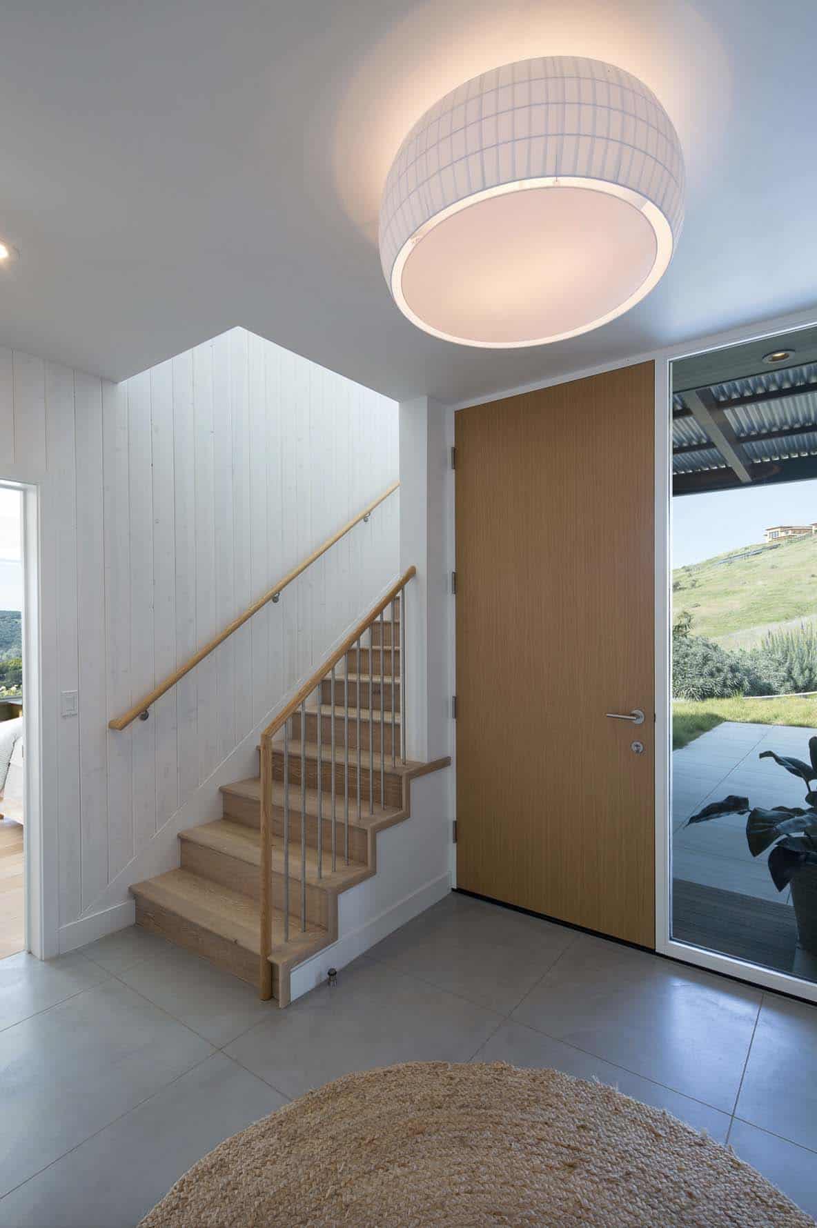 contemporary farmhouse entry with a staircase