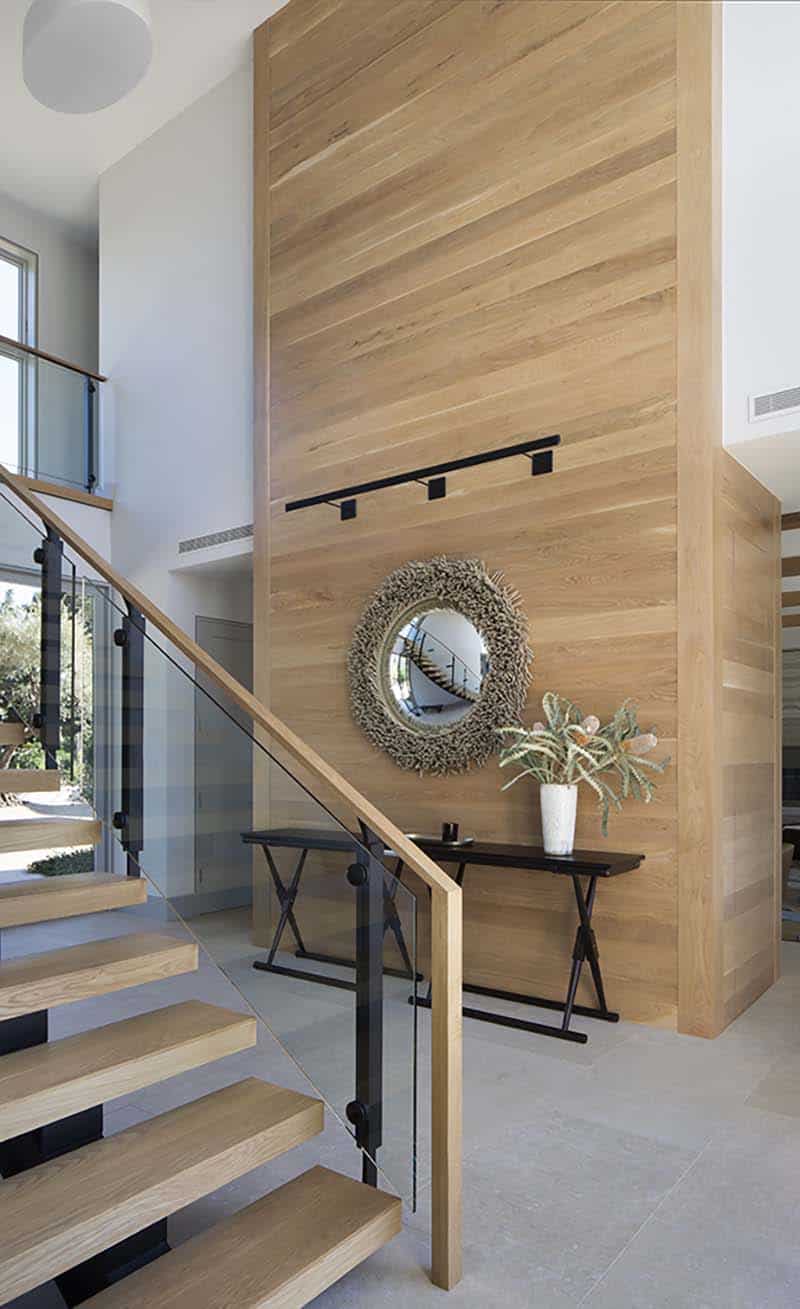 contemporary farmhouse entry with a staircase and entry console