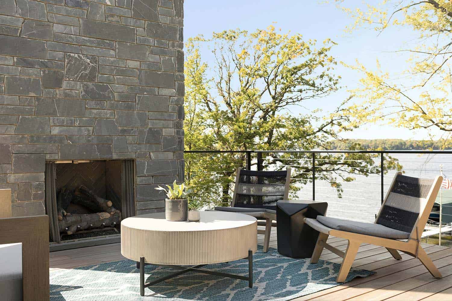 contemporary patio with outdoor furnishings and a fireplace