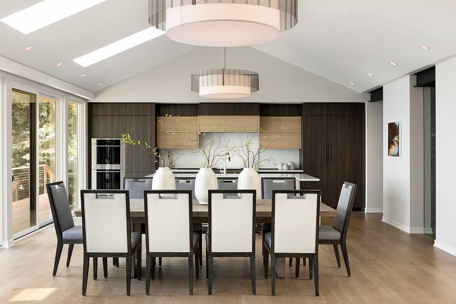 contemporary dining room open to the kitchen