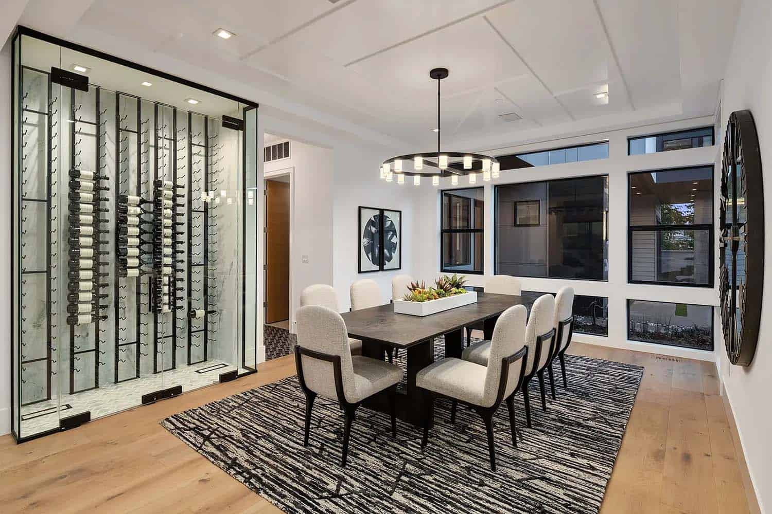contemporary formal dining room with a wine display