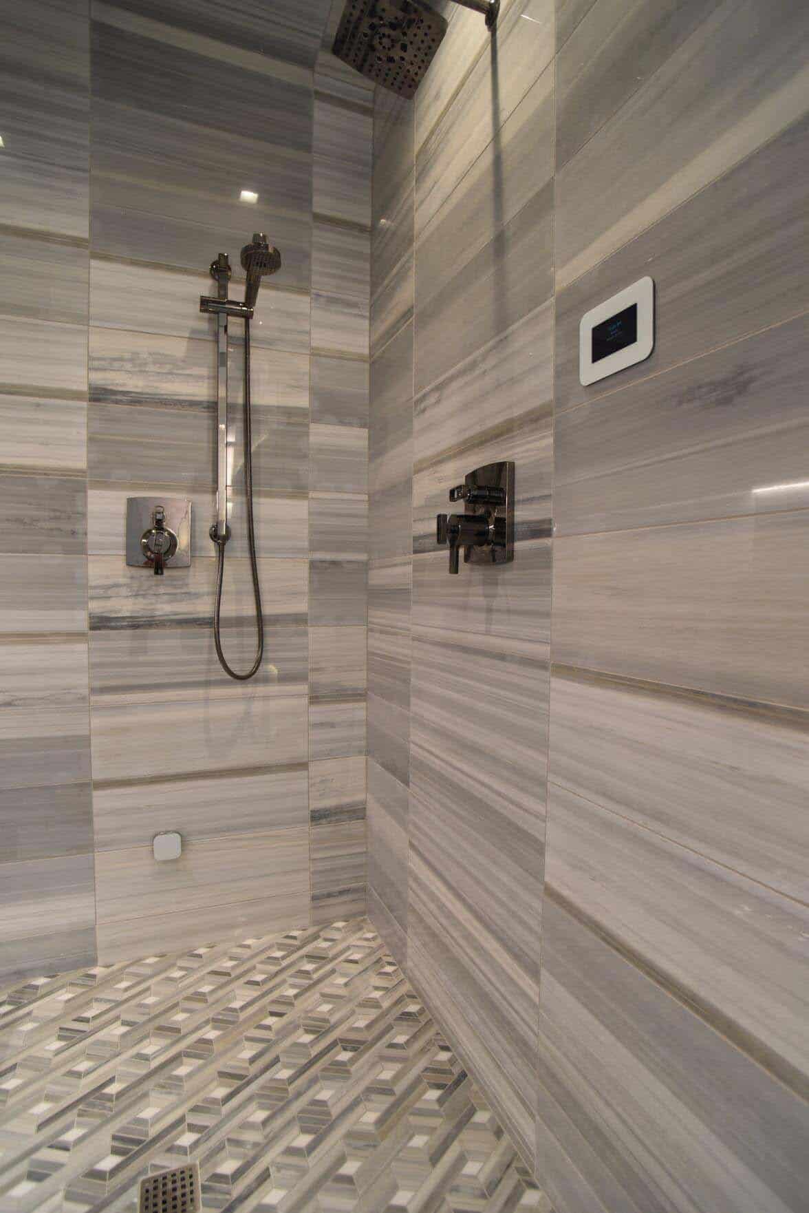 contemporary primary bathroom with a marble shower