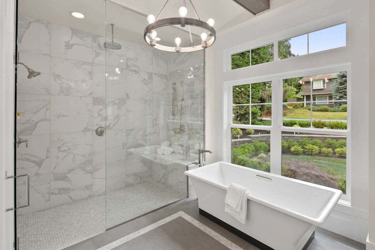 contemporary bathroom with a marble shower and soaking tub