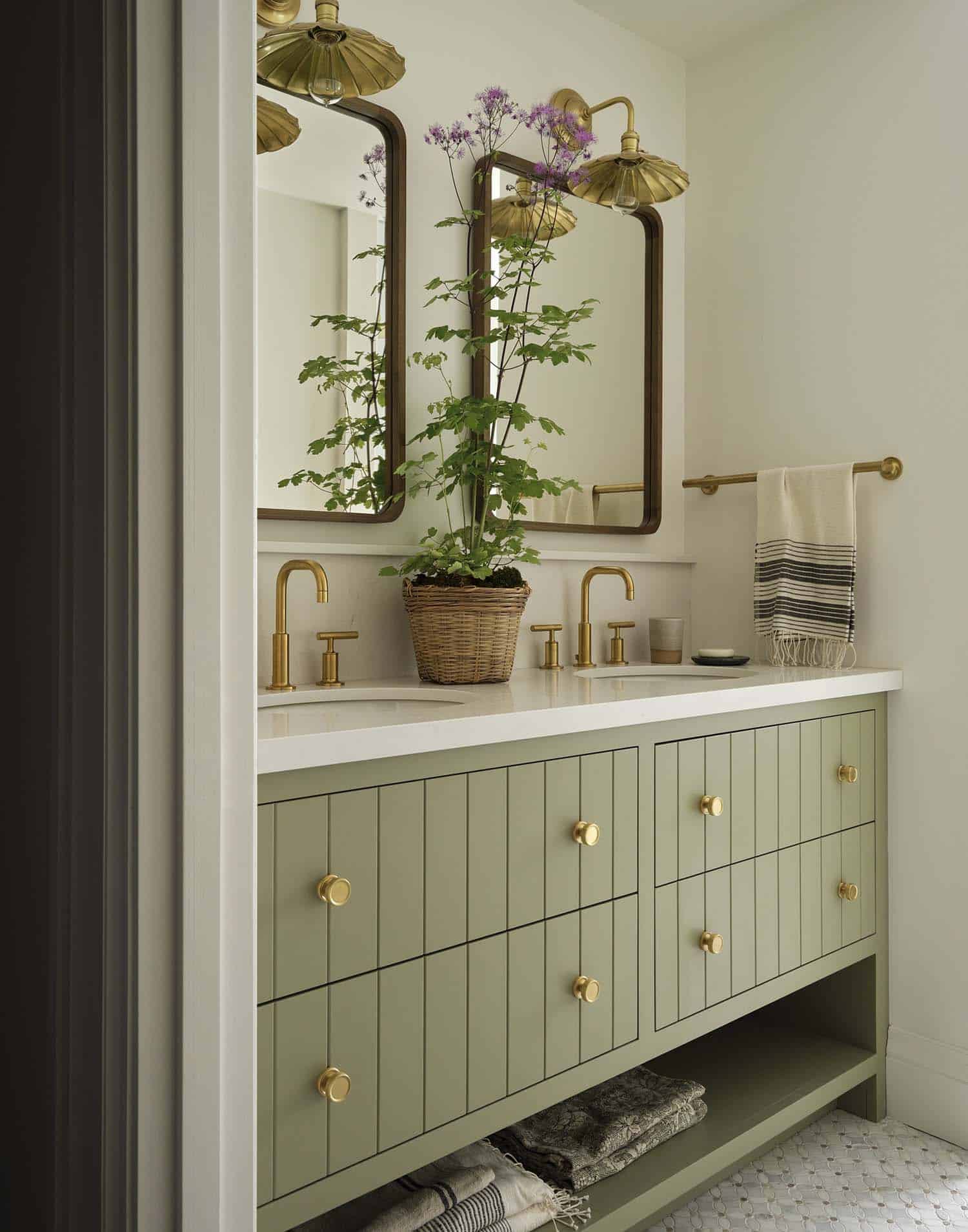 contemporary bathroom with sage green cabinets