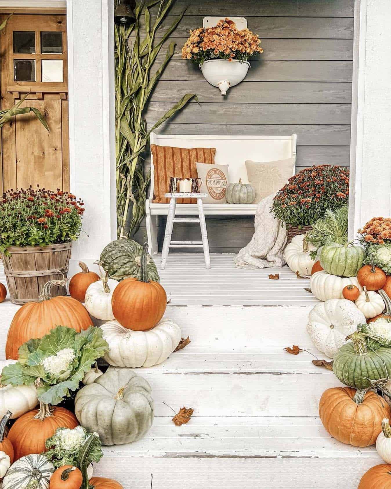 farmhouse home front porch with fall pumpkins