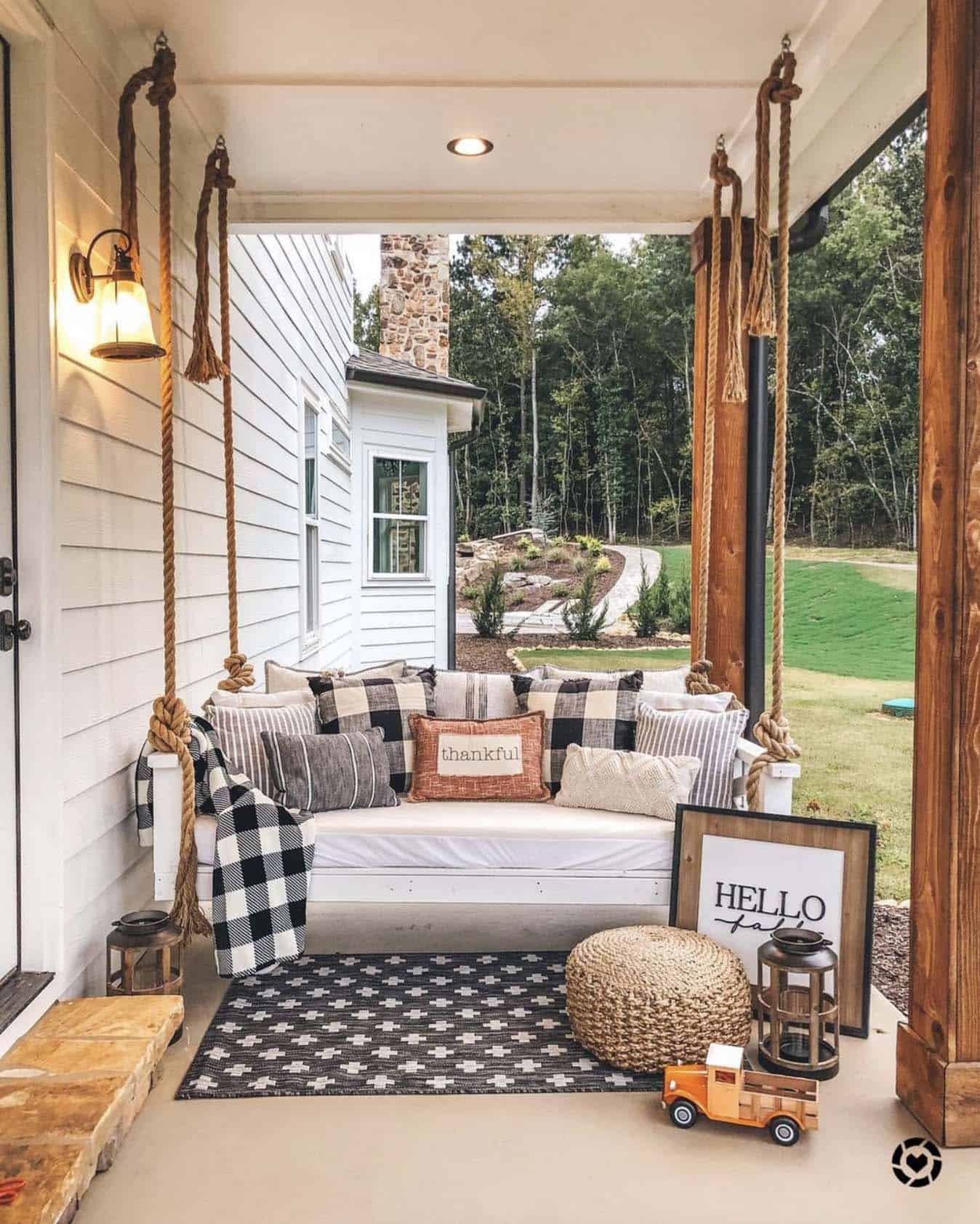 outdoor porch swing with fall pillows