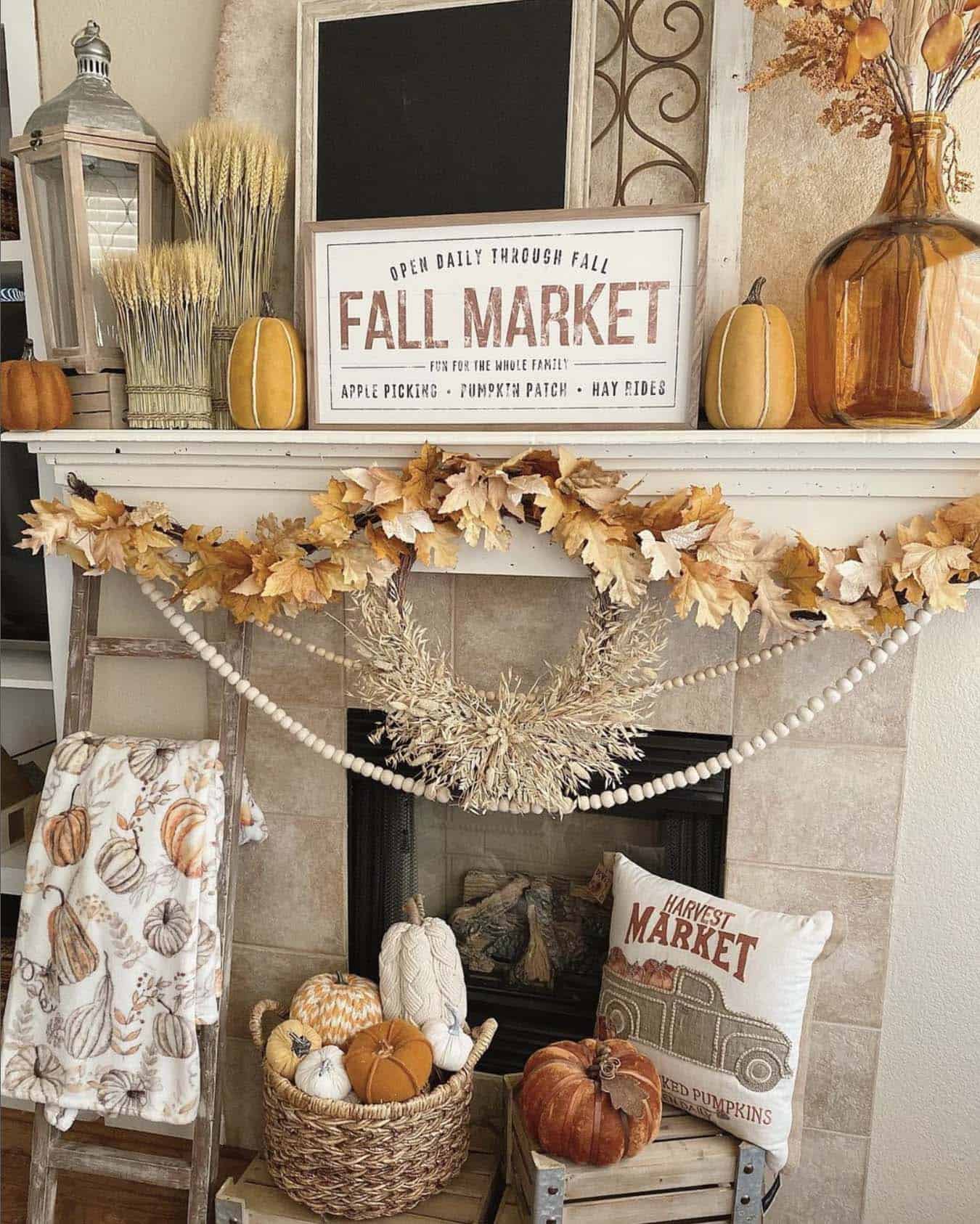 fireplace mantel with fall decorations