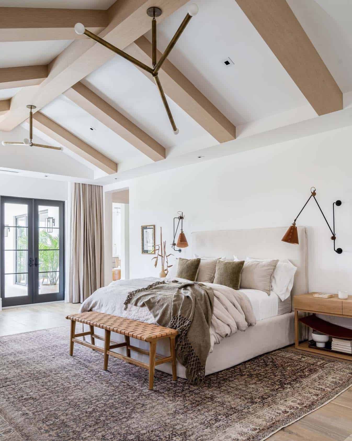 cozy bedroom tall ceilings and a vintage rug