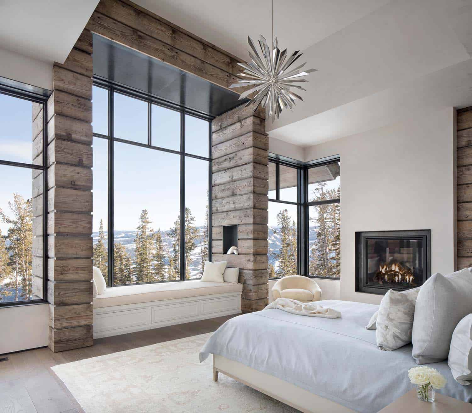 modern ski home bedroom with a window seat and views