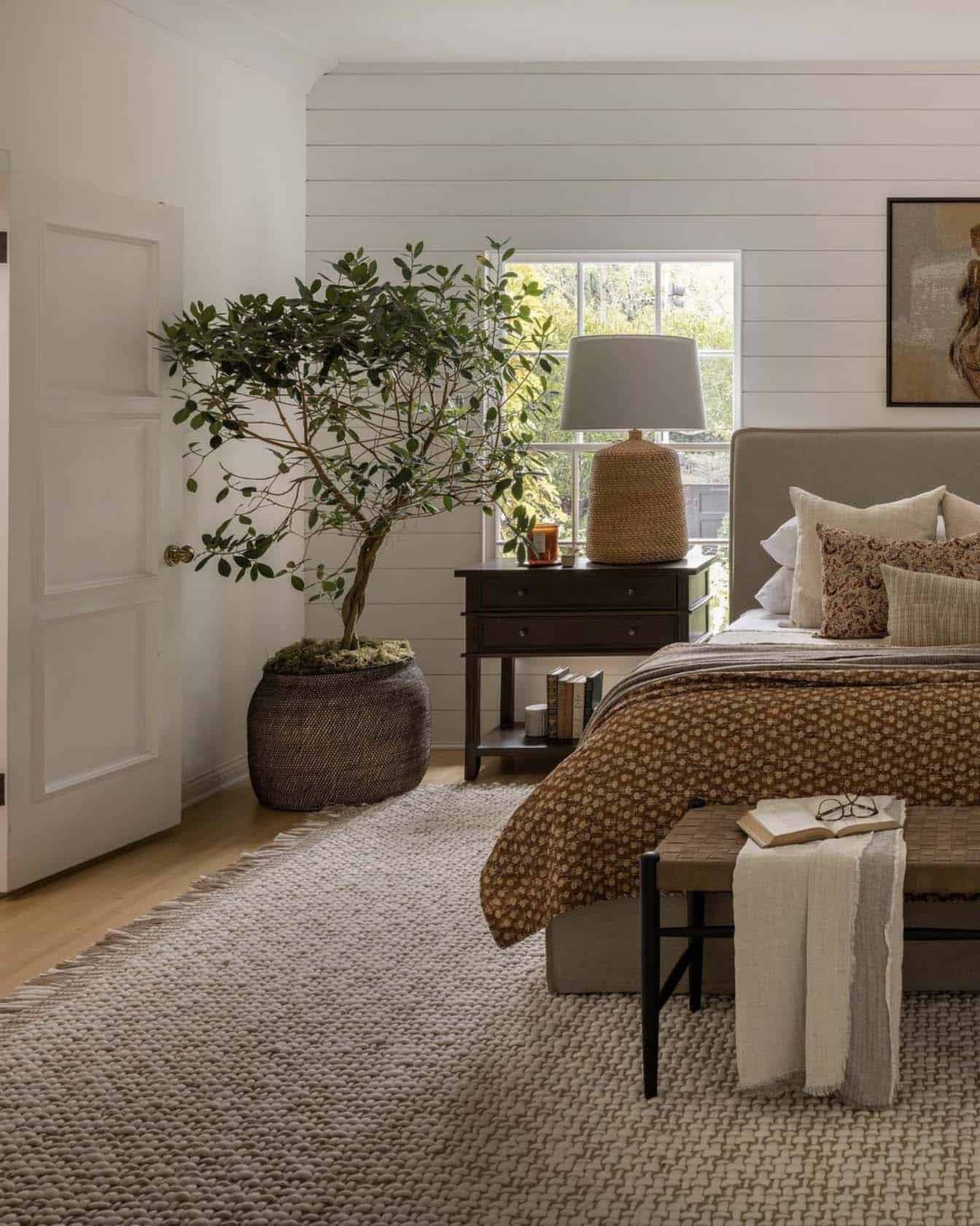 cozy bedroom with layers of warm neutral tones
