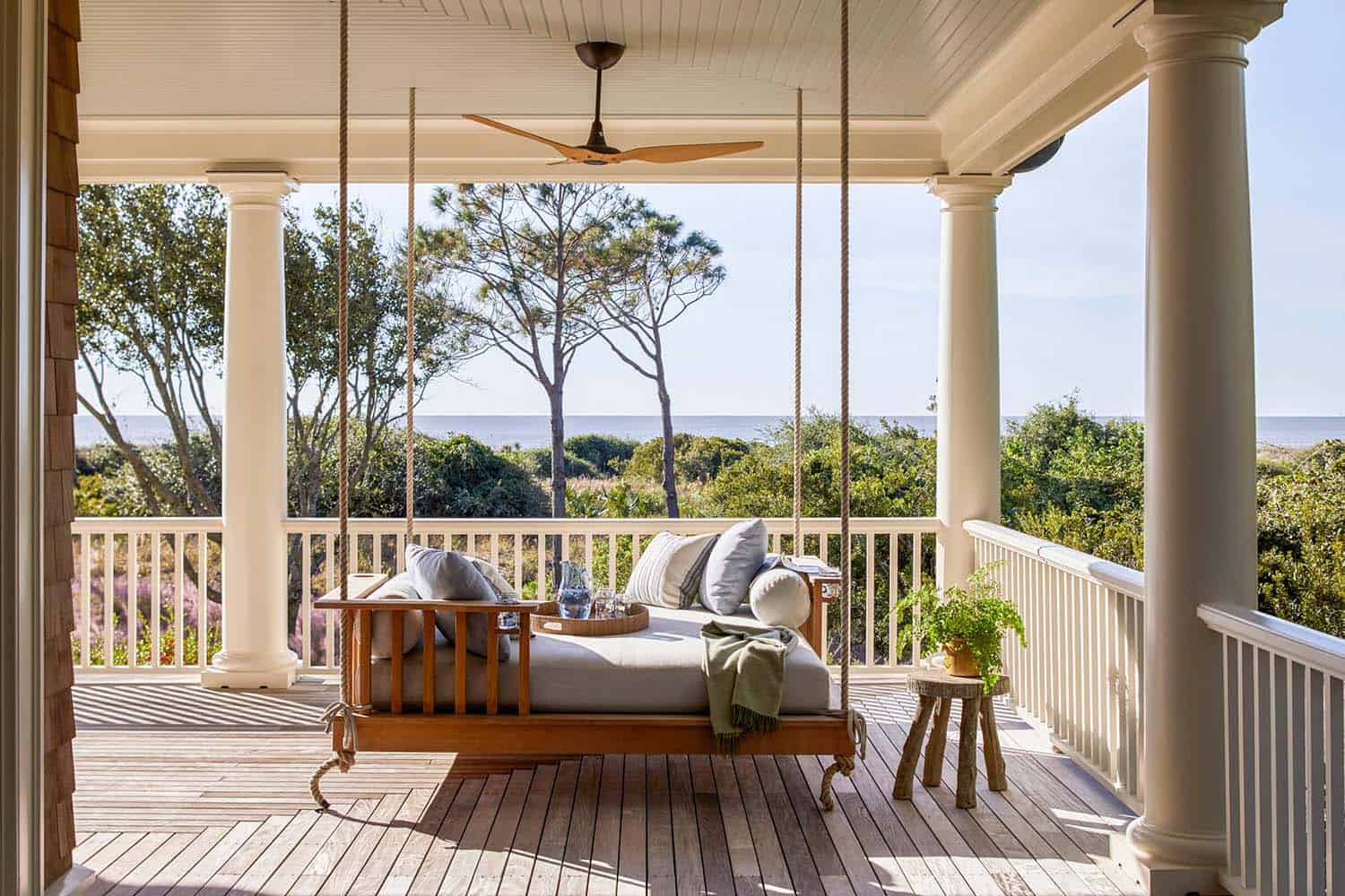 beach house deck with a hanging swing