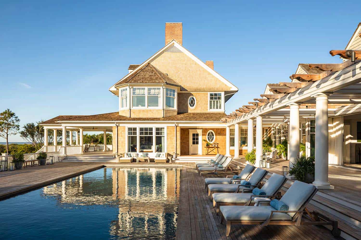 beach style swimming pool and pool house