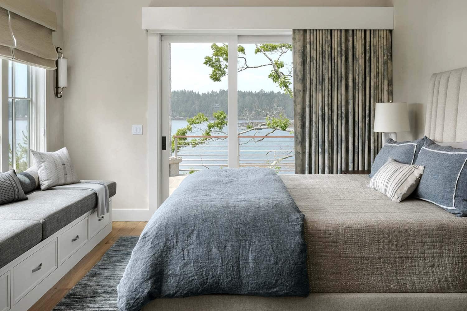 modern coastal bedroom with a window seat