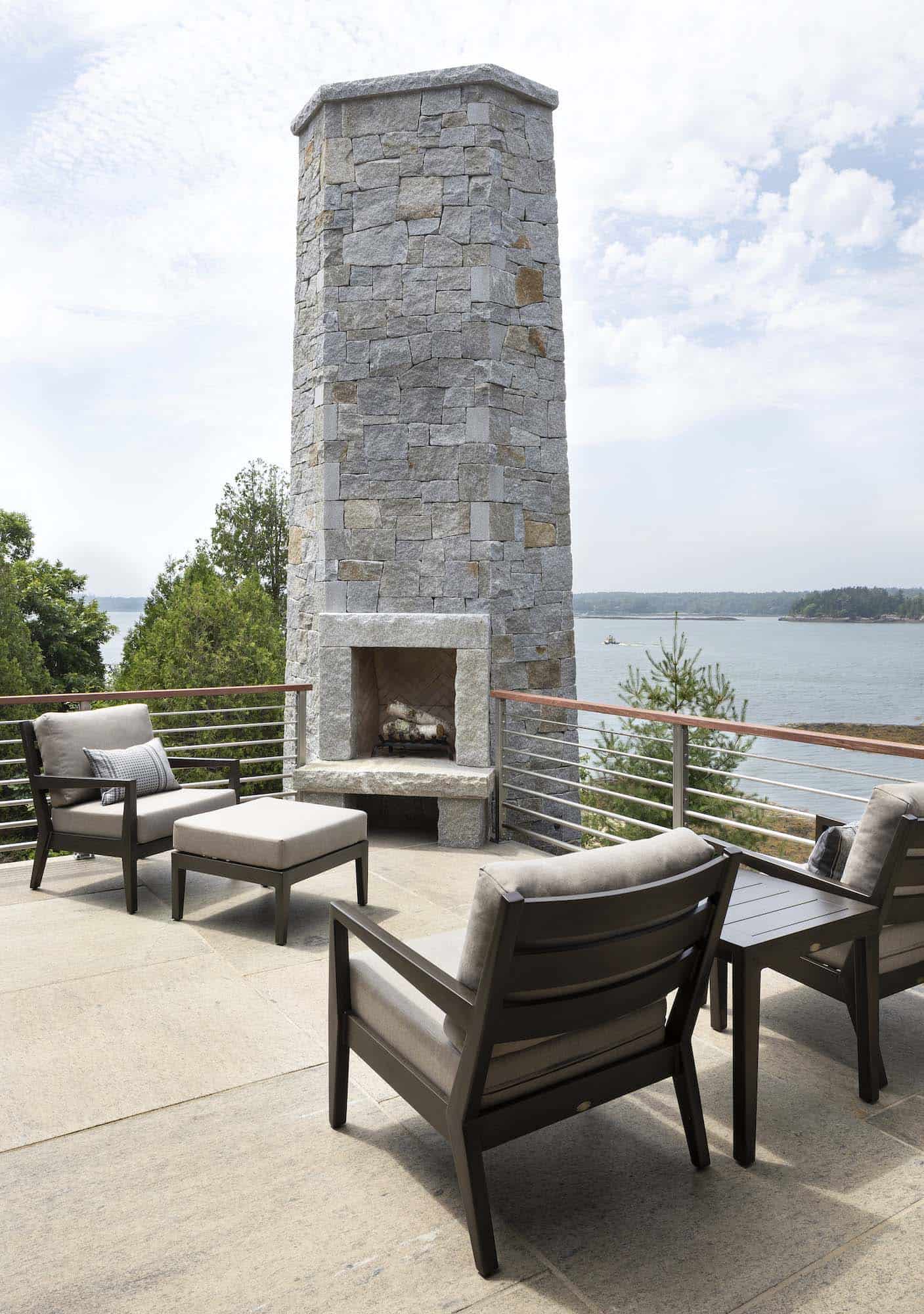 modern coastal deck with a fireplace