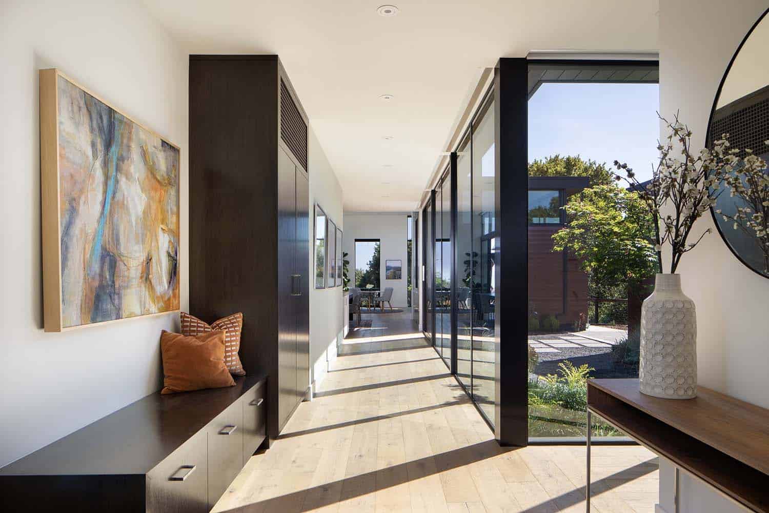 modern contemporary home entry with a built-in bench