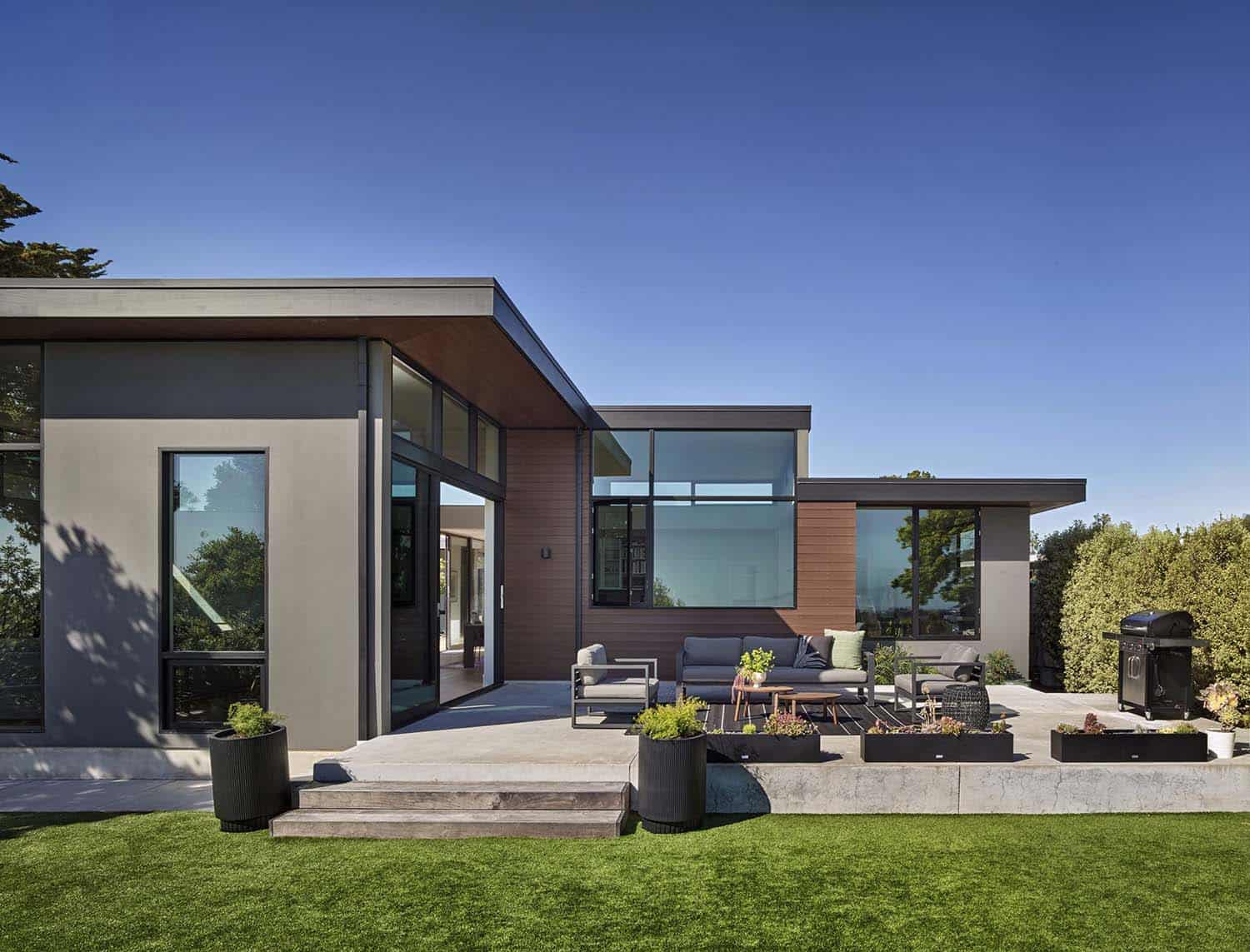 modern contemporary home exterior with a large patio