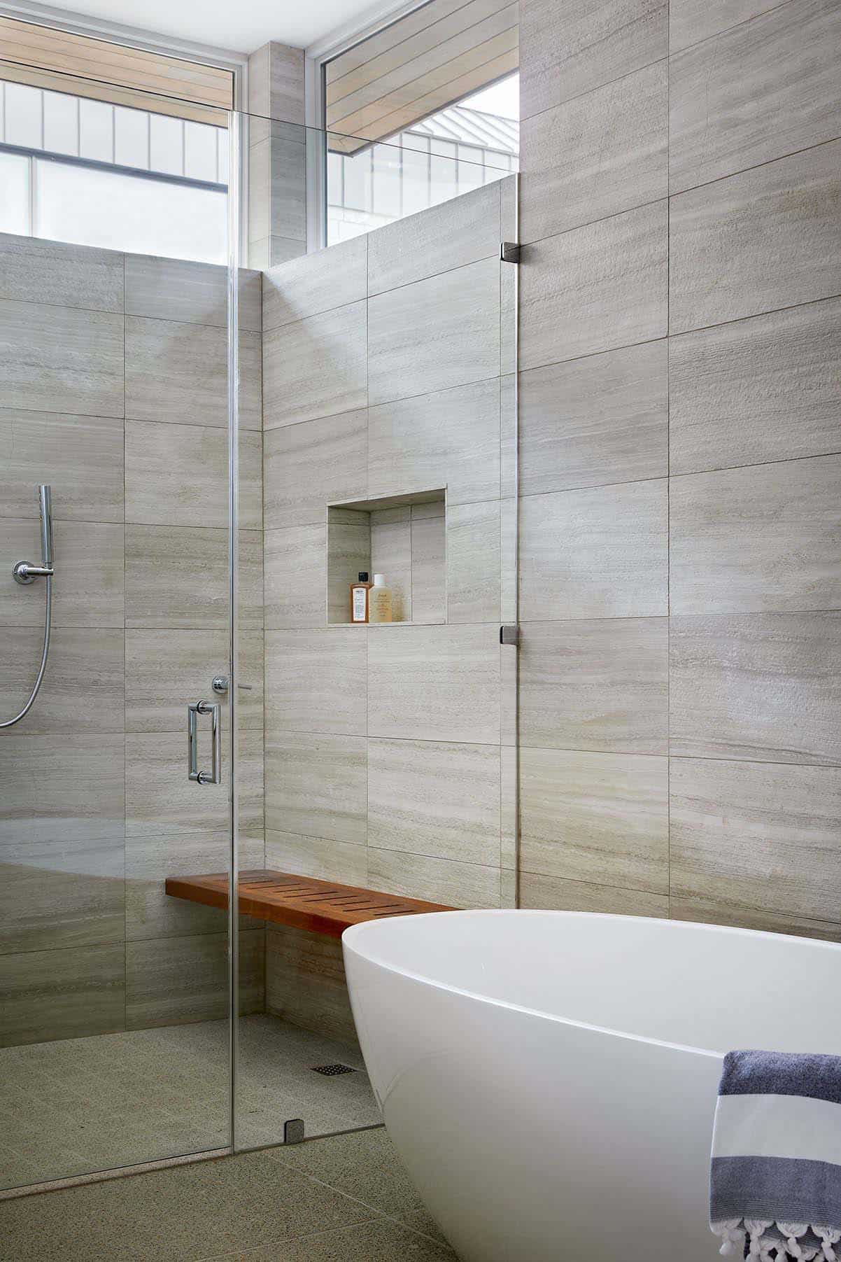 modern bathroom with a freestanding tub and a walk in glass shower