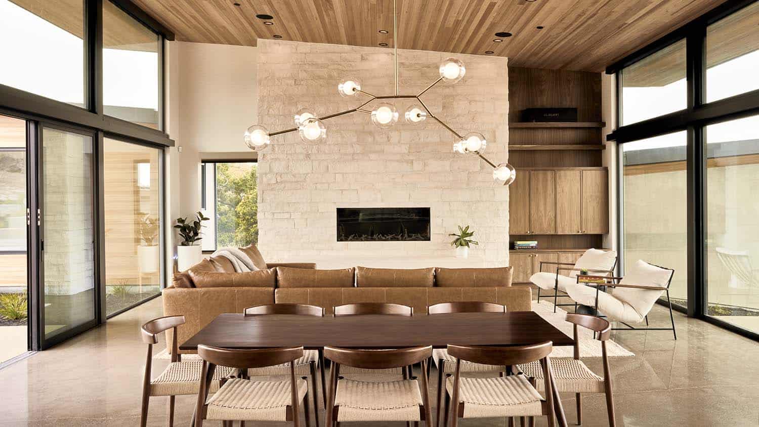 modern dining room with a large chandelier
