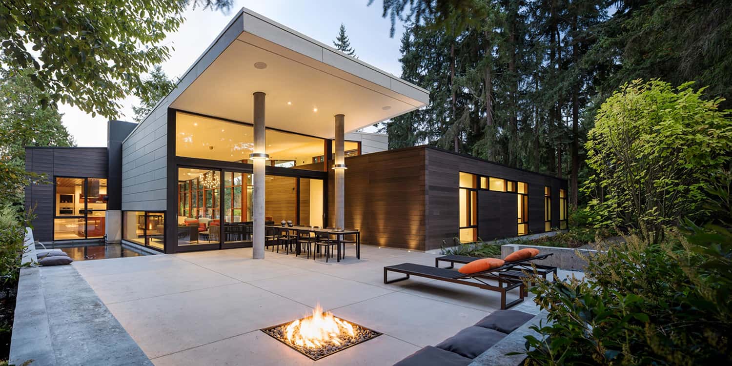 modern house backyard patio with a fire pit