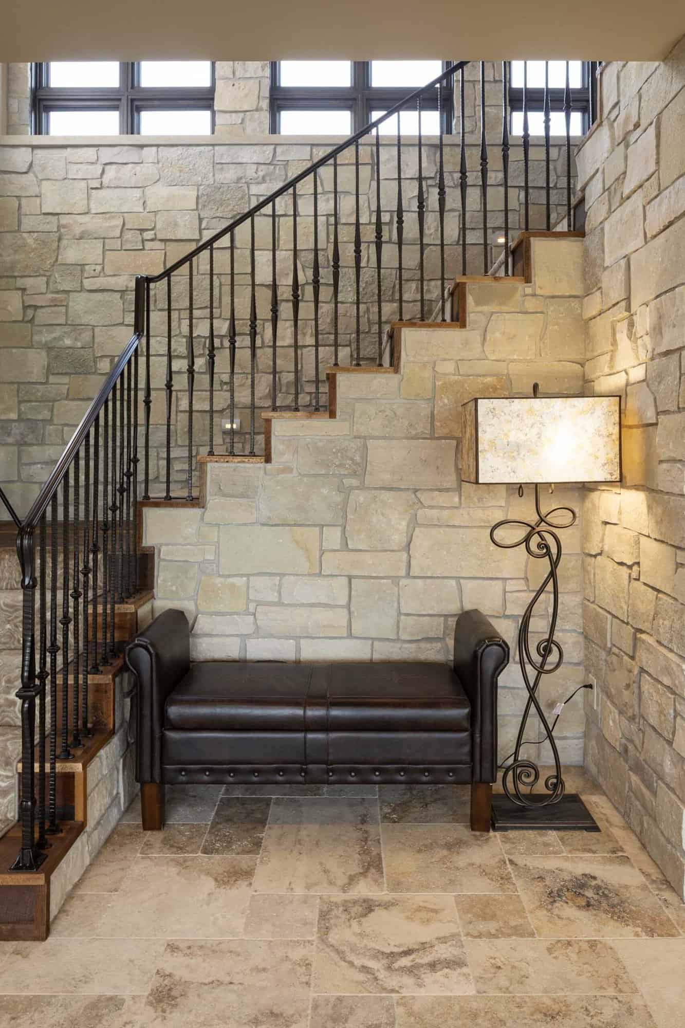 modern tuscan inspired staircase to lower level
