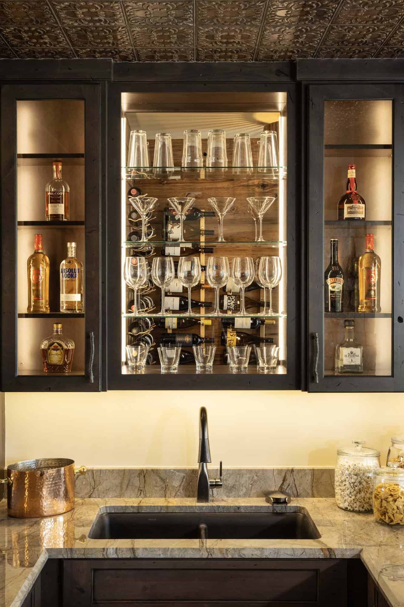 modern tuscan inspired home bar glass cabinet detail 