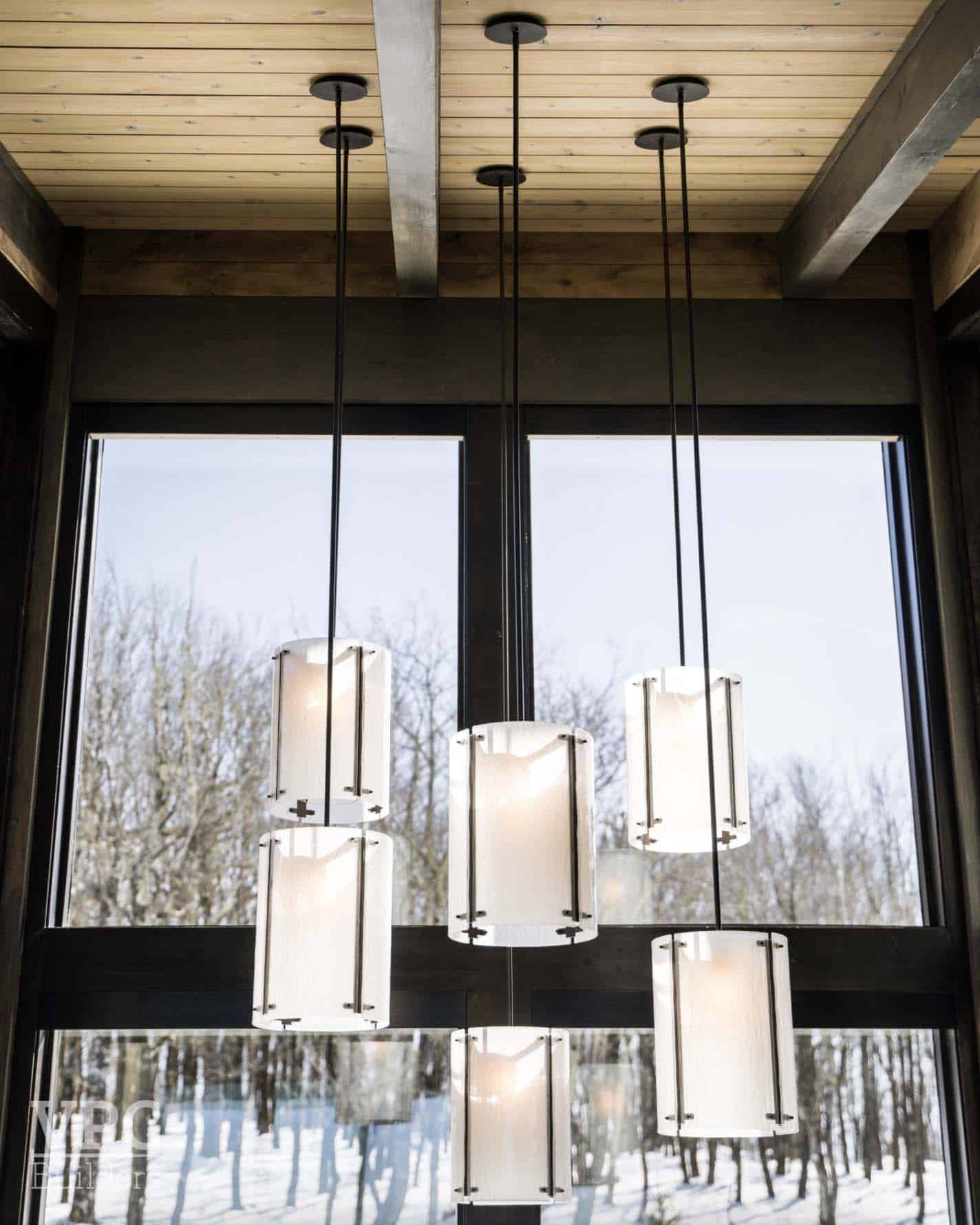 contemporary home entry with pendant lights