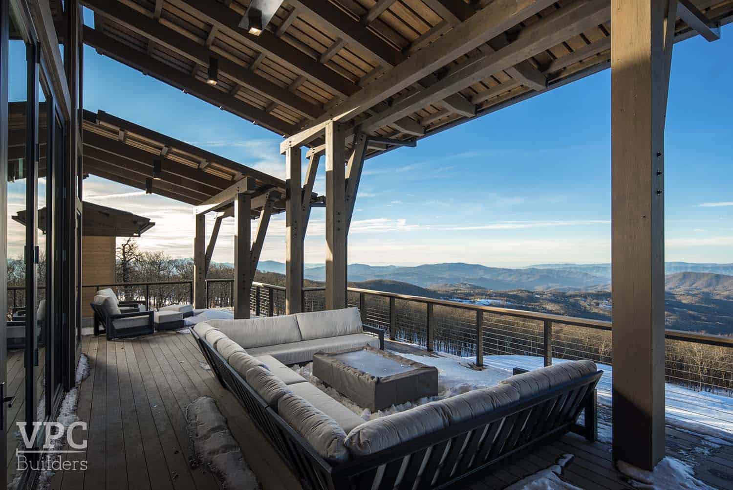 modern mountain lodge covered patio with outdoor sectional and views