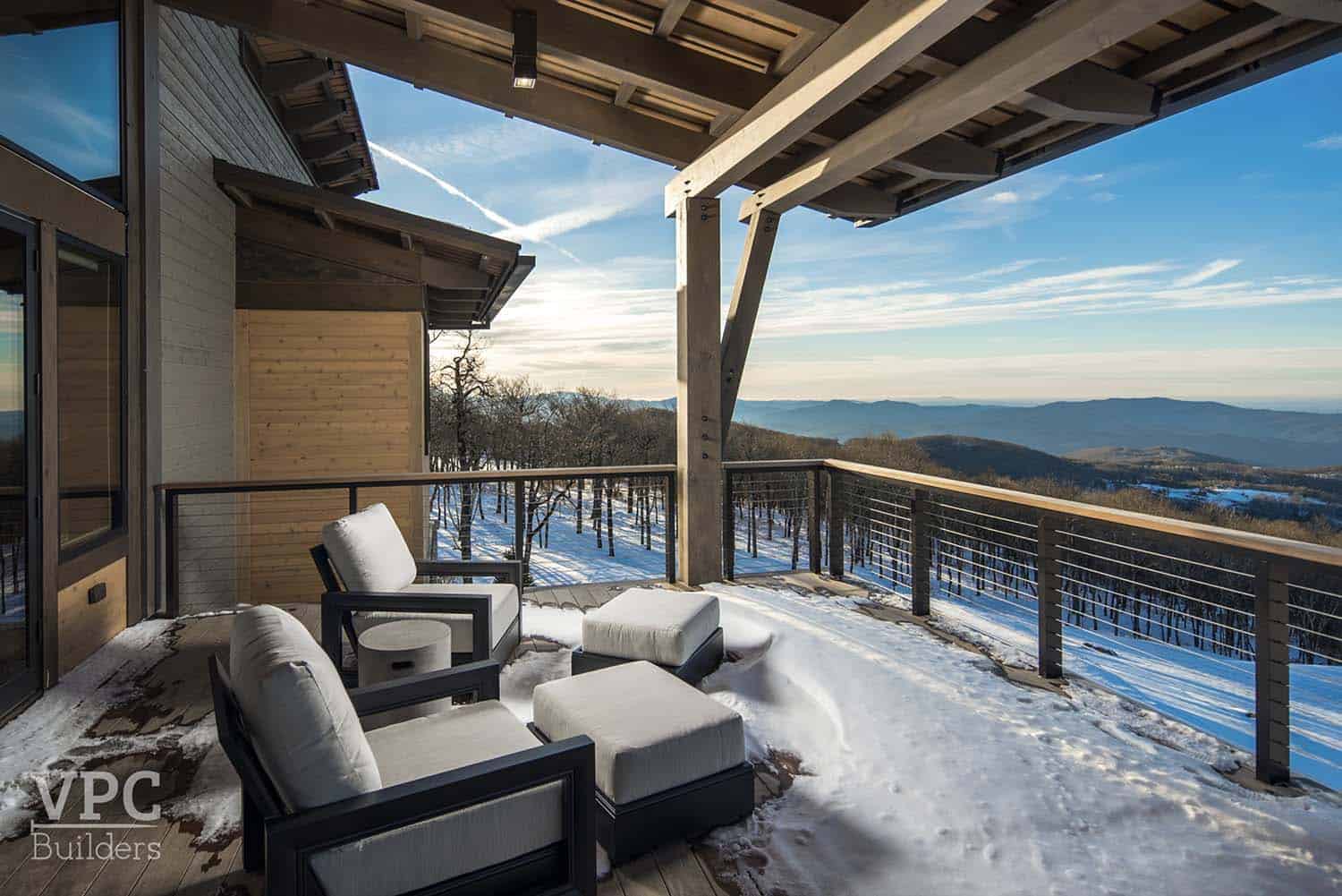 modern mountain lodge outdoor balcony with snow