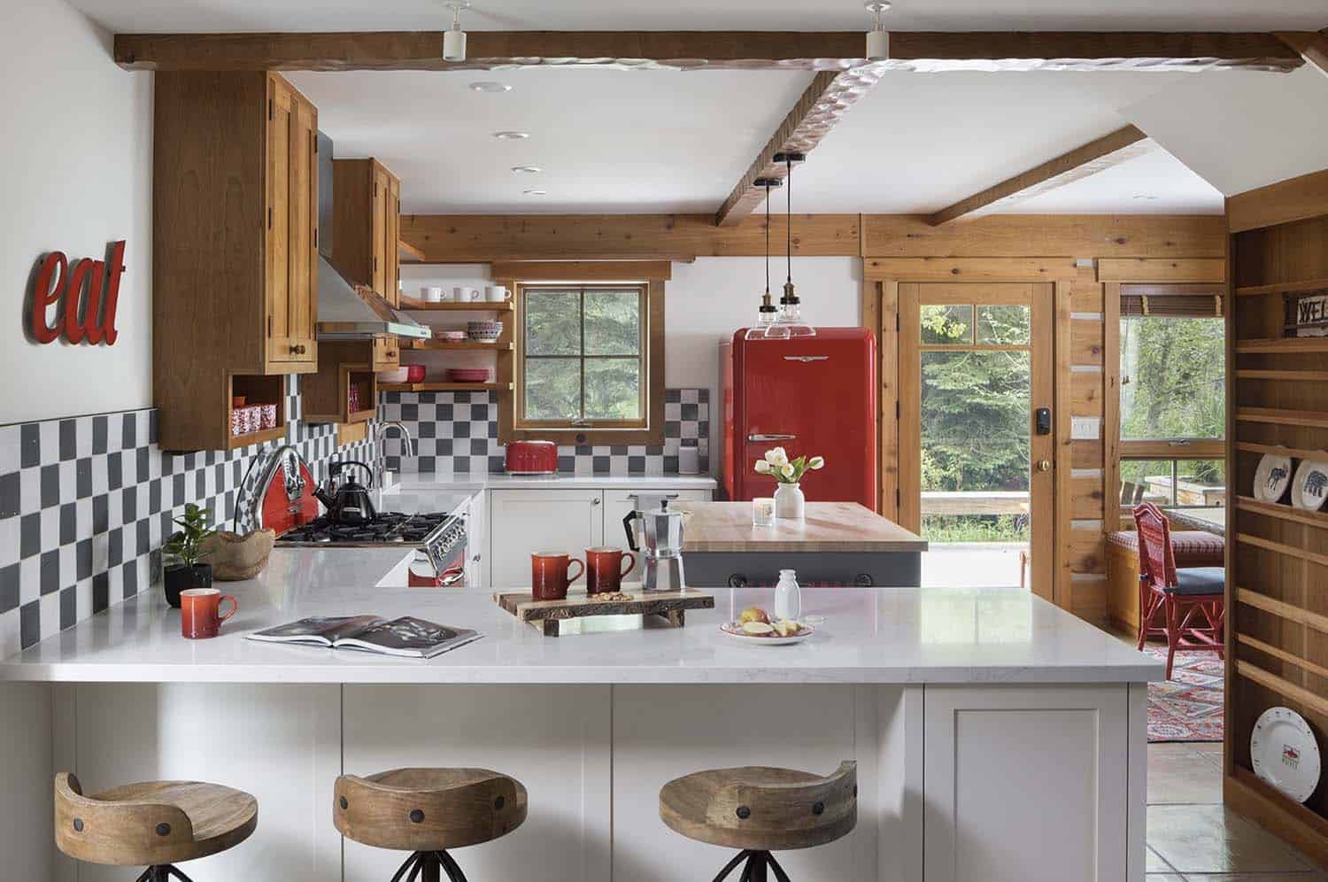 rustic kitchen with a red fridge