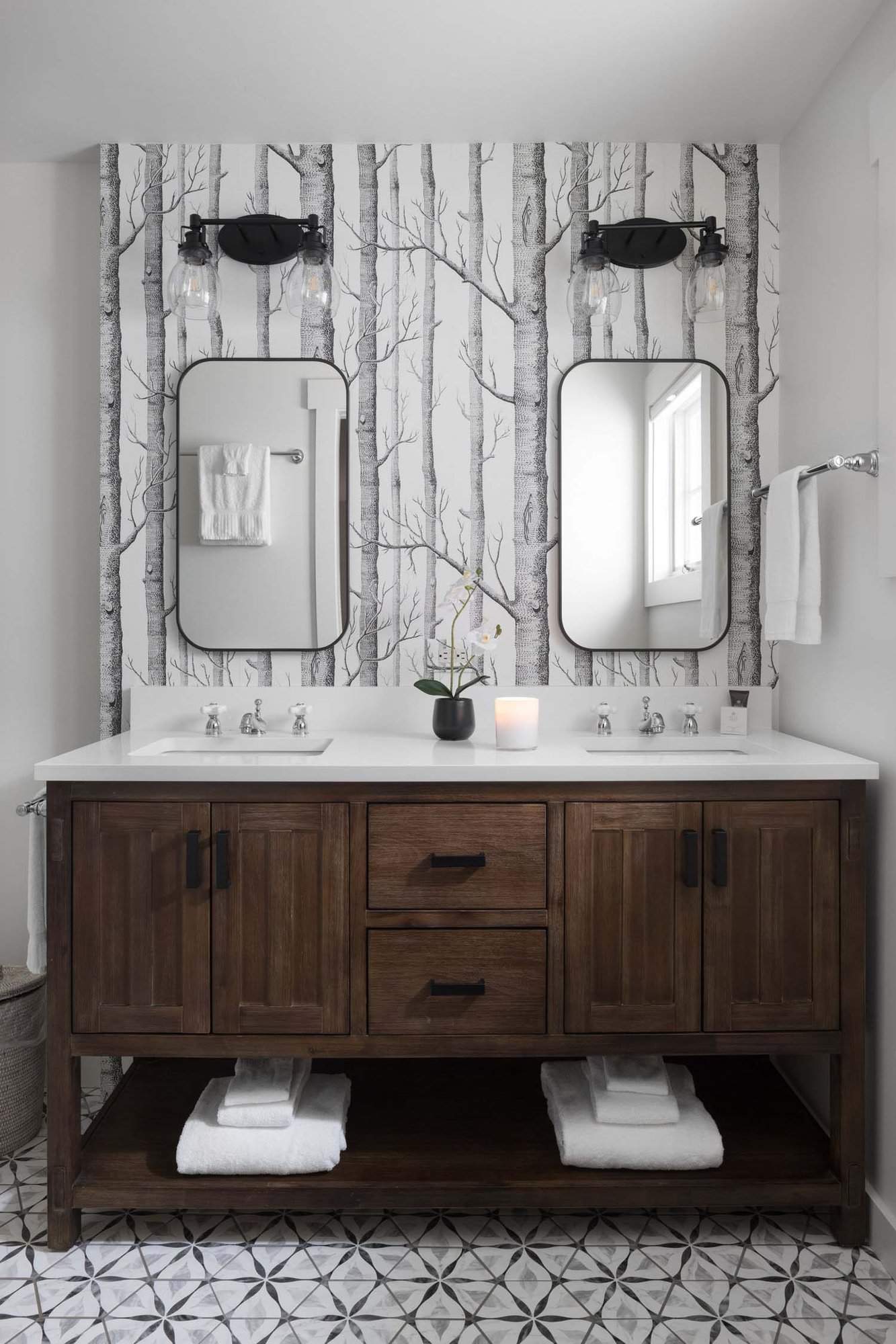 rustic bathroom with a trees wallpaper