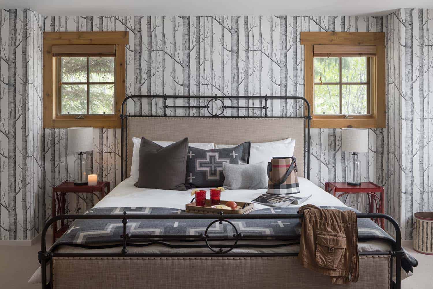 rustic bedroom with a trees wallpaper