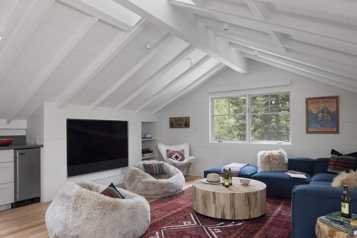 rustic attic family room with skylights