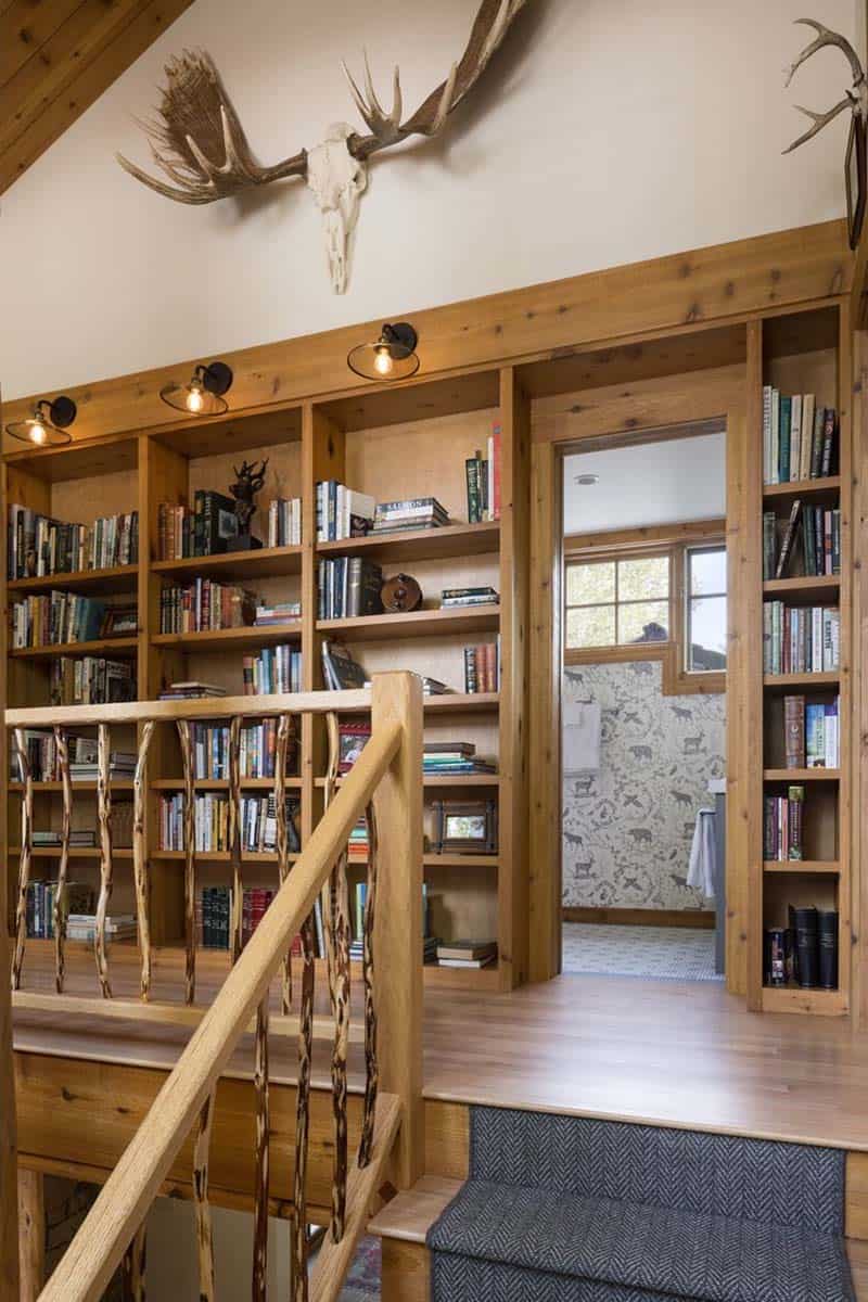 rustic hallway with custom bookshelf wall