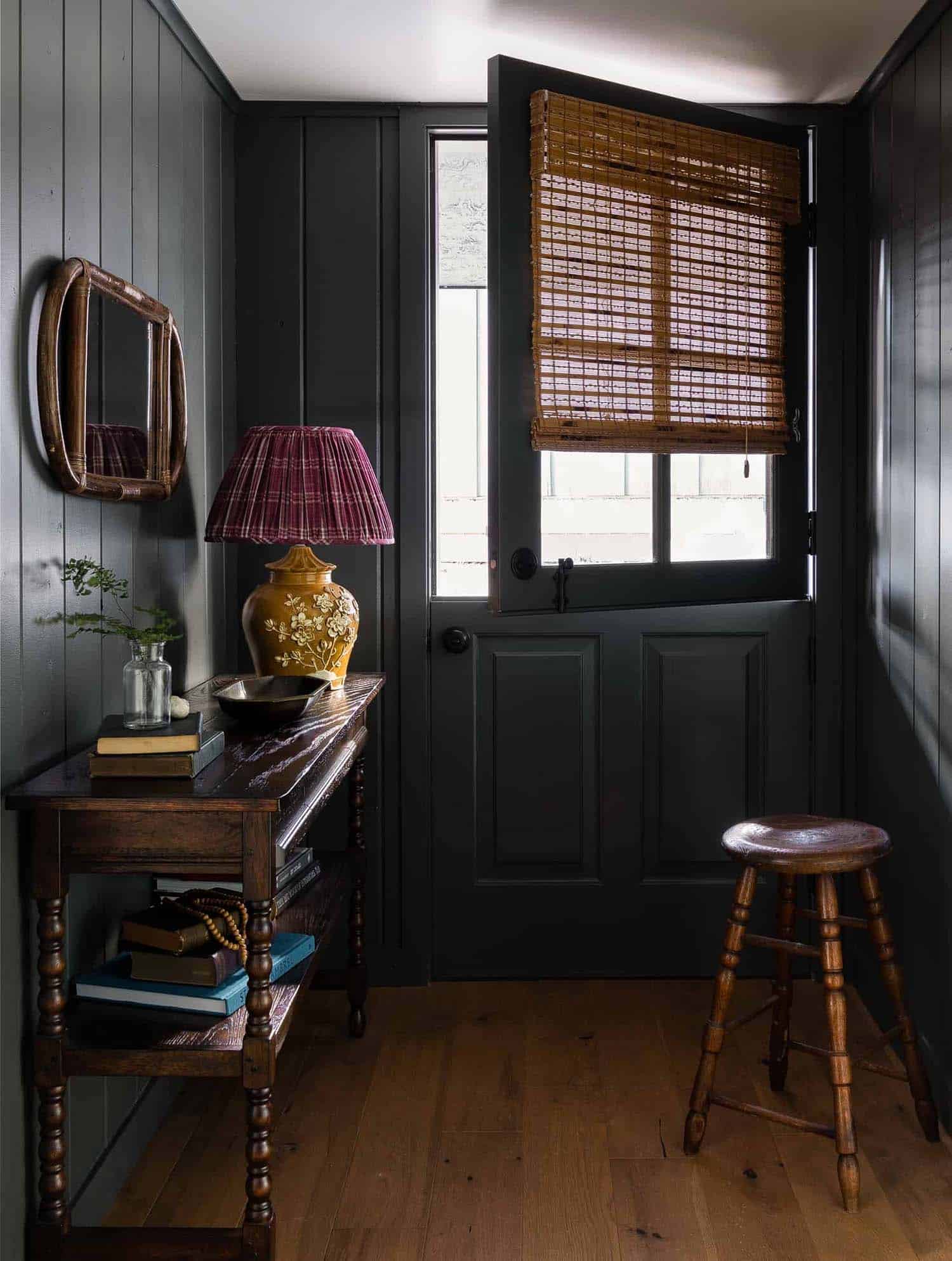 modern traditional cabin entry with a plaid lampshade