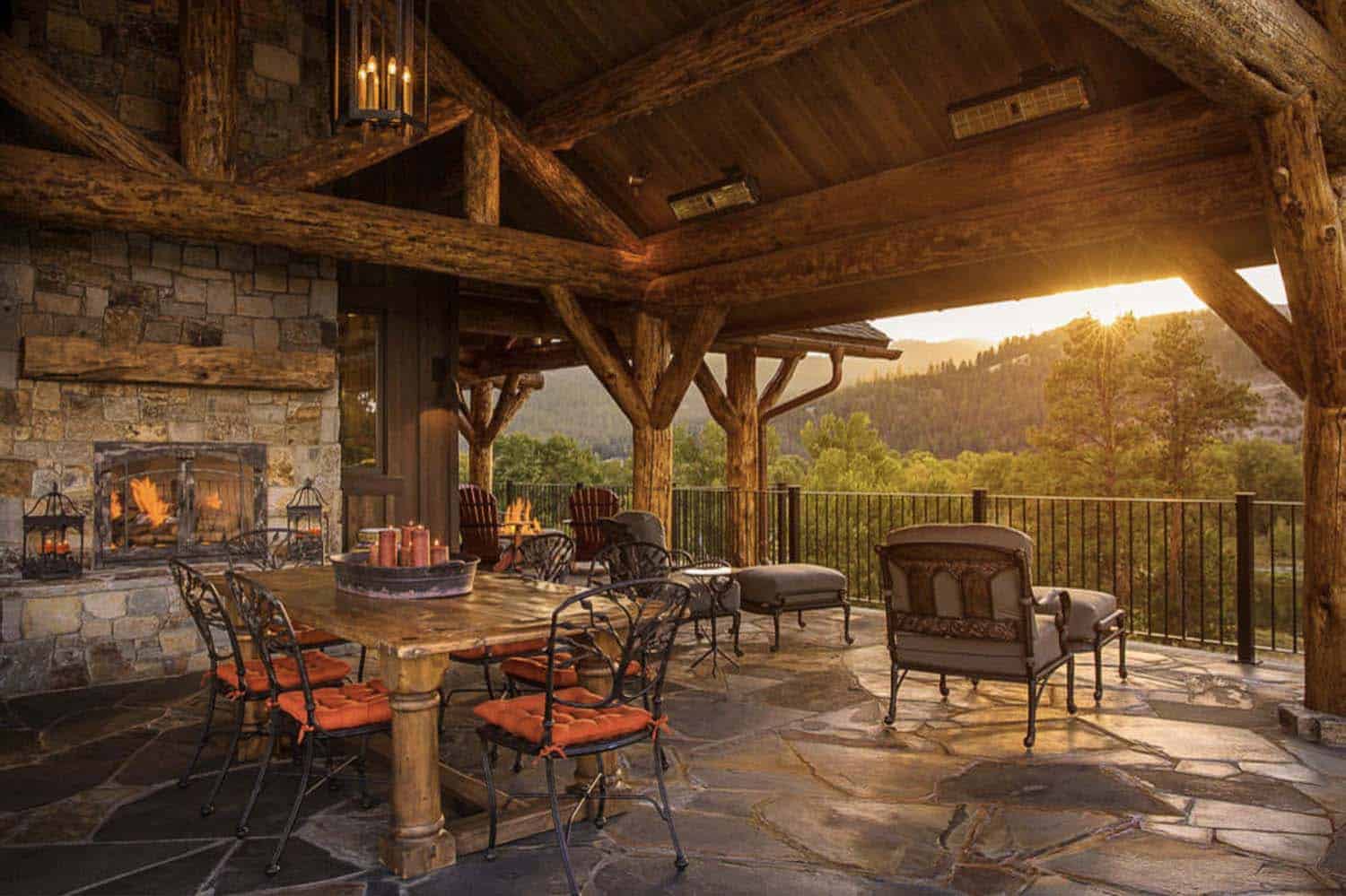 rustic mountain house patio with a fireplace and outdoor furniture