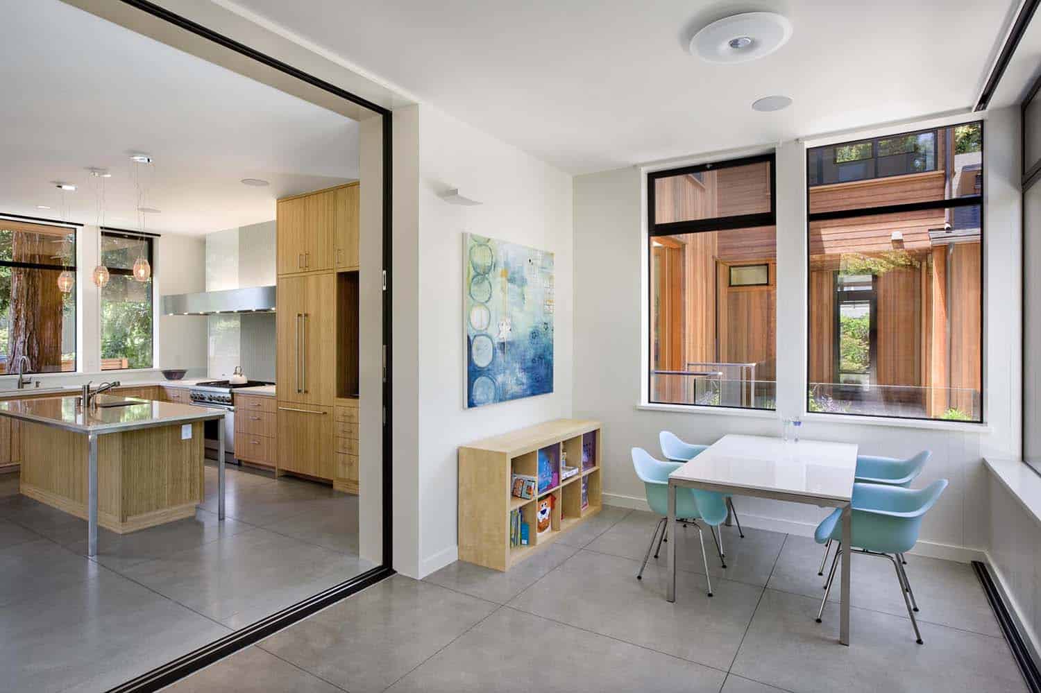 view of the indoor-outdoor porch opens to the kitchen with sliding glass doors that pocket into the wall
