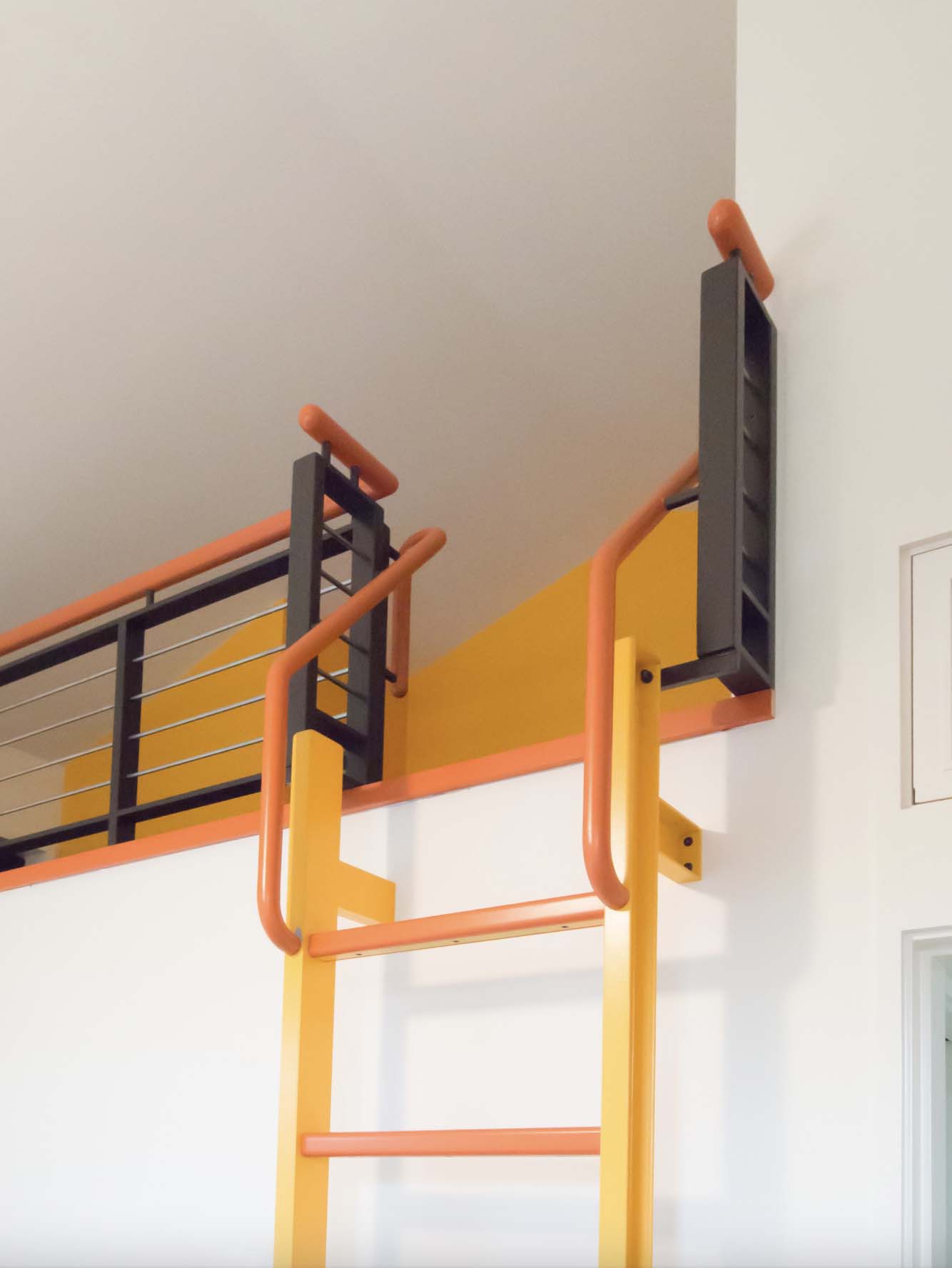 detail of loft access in the kid's bedroom, steel ladder, and steel guard rail
