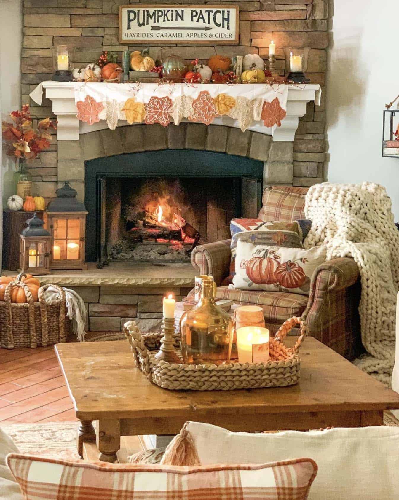 rustic family room with a cozy fireplace and fall decorations 