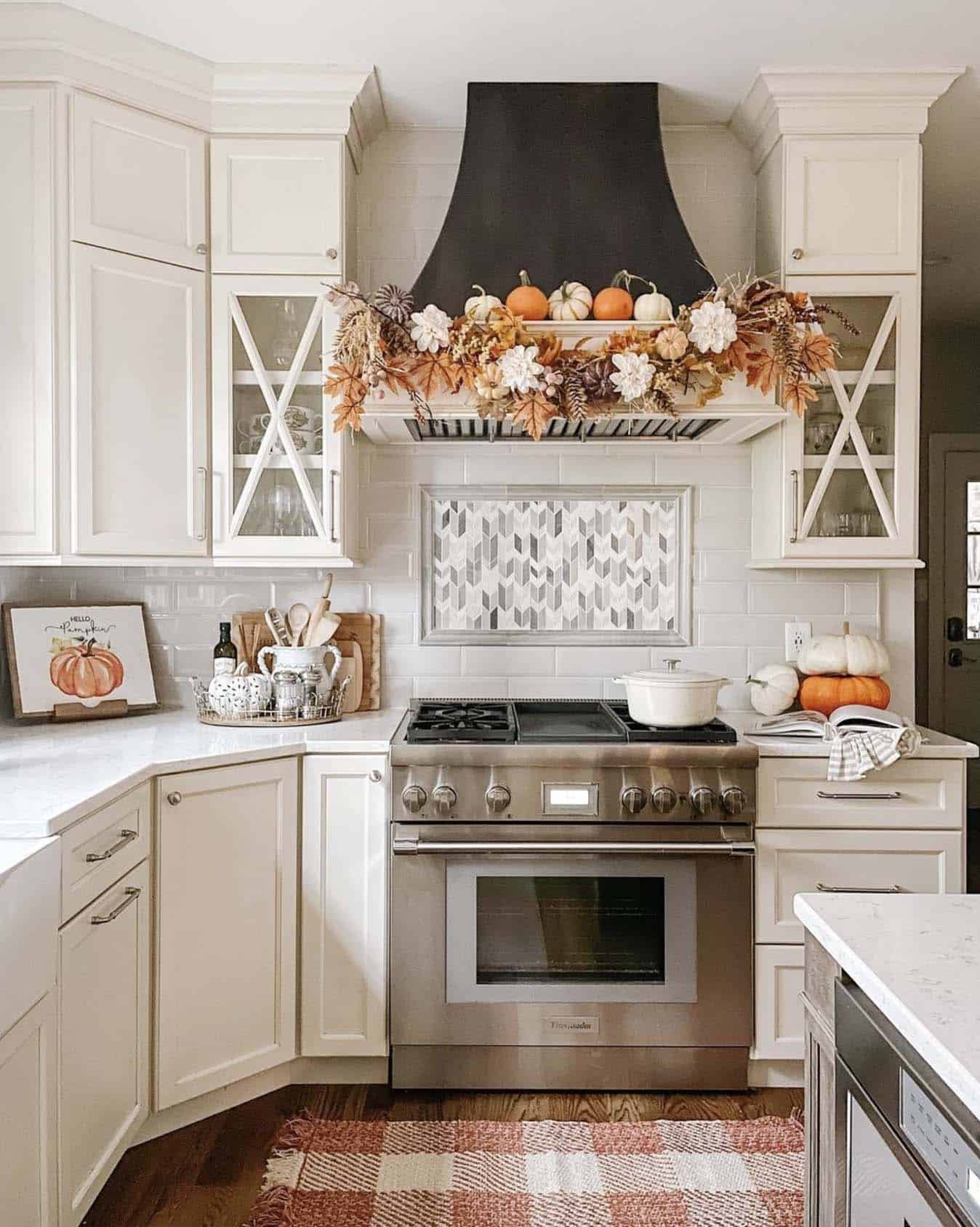 fall decorated kitchen with a garland on the vent hood