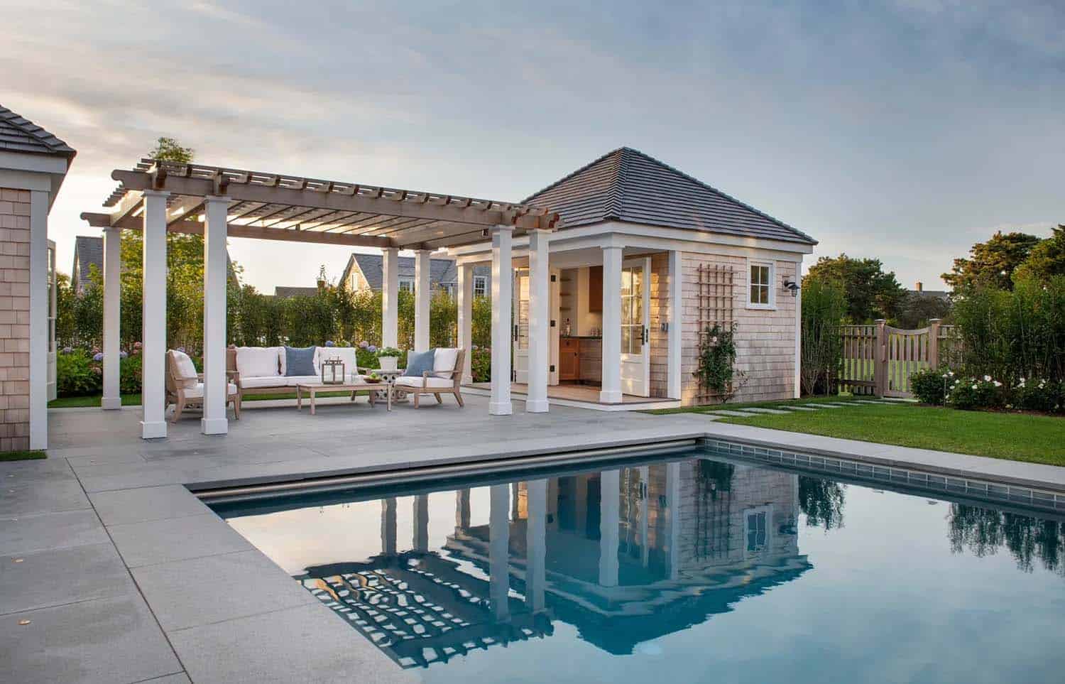 coastal style home swimming pool and pool house
