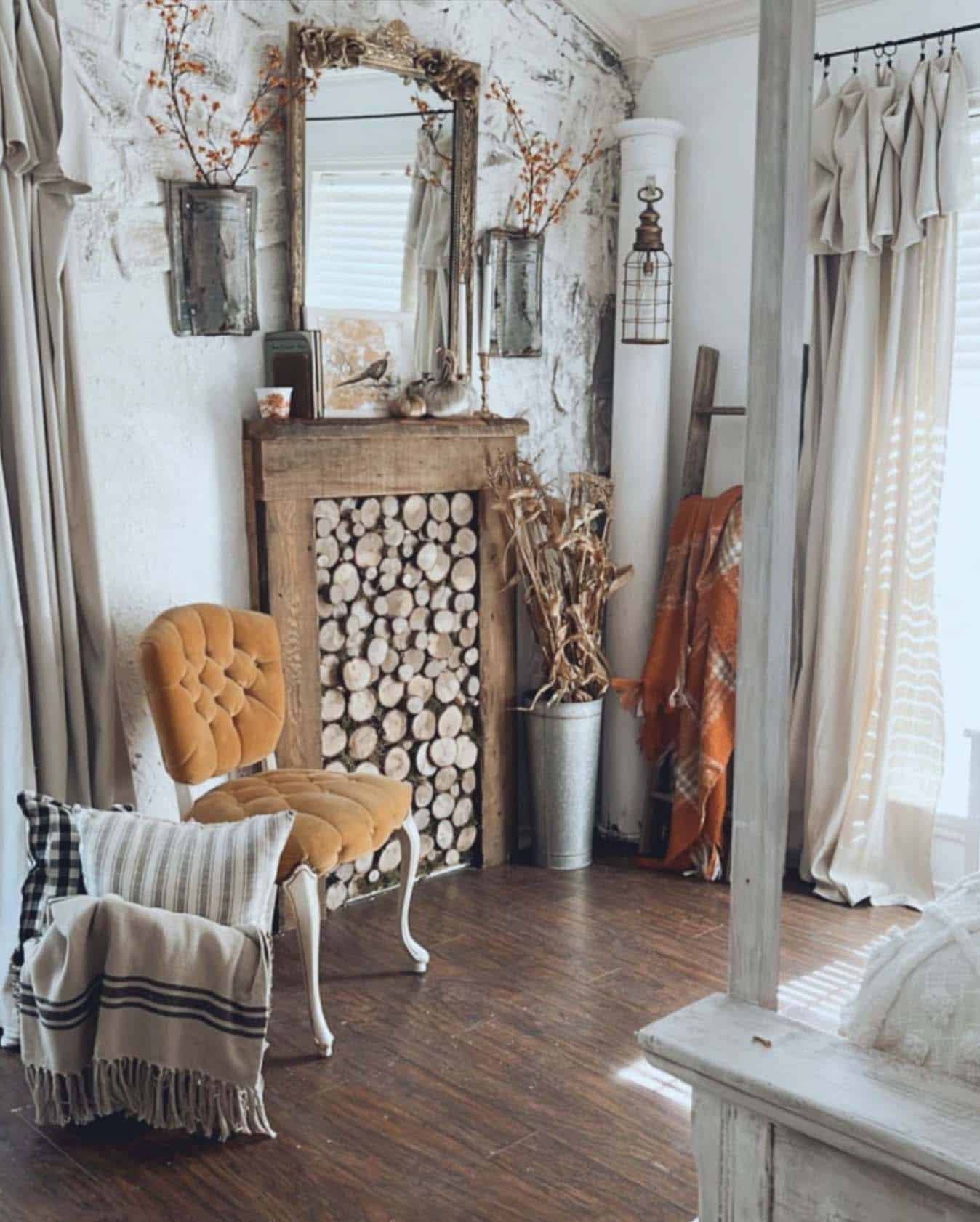rustic fall bedroom with a faux fireplace