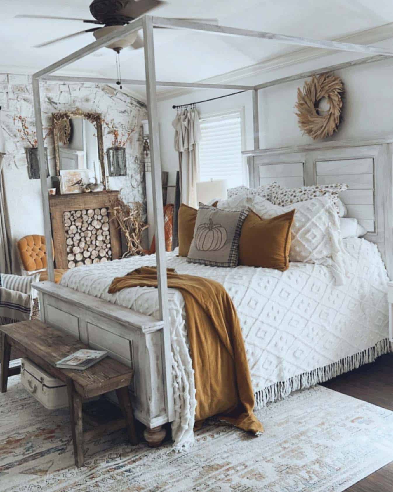 rustic fall bedroom with a faux fireplace