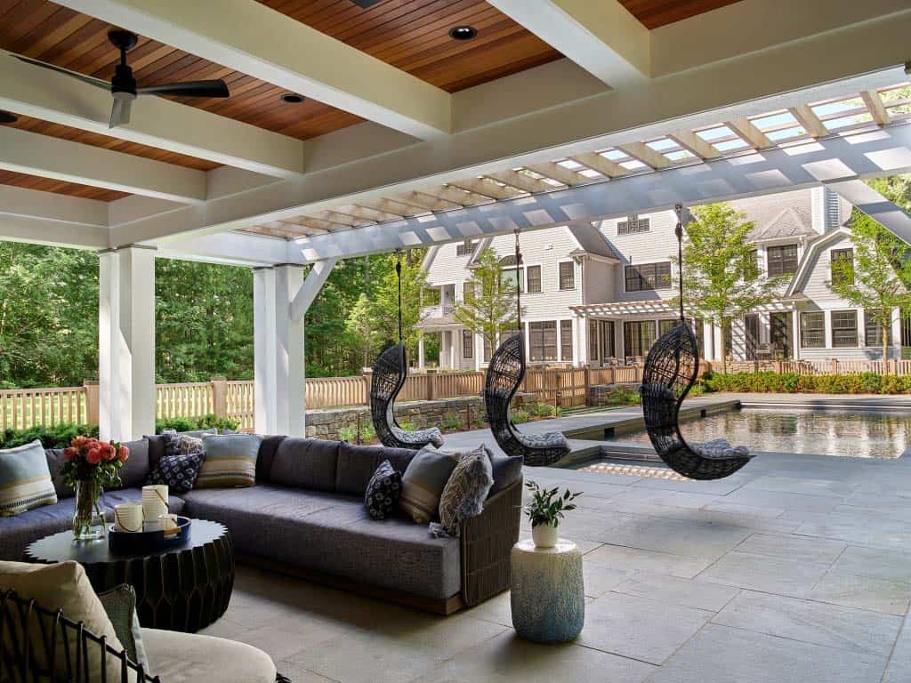 contemporary covered patio with hanging chairs