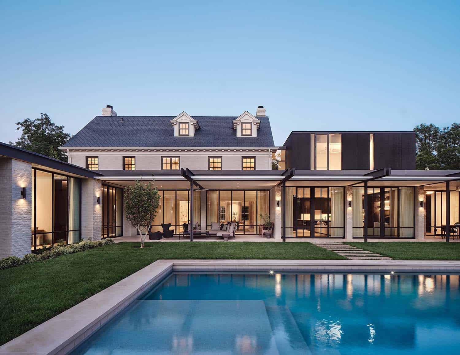Georgian revival home exterior with a modern extension and a swimming pool